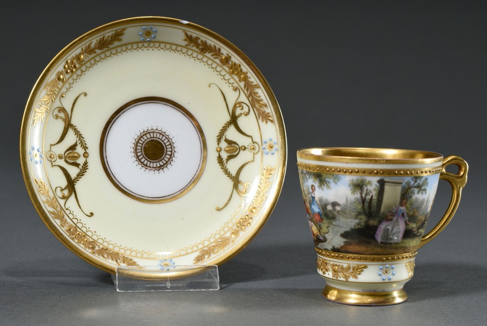 Dresden demitasse/saucer with polychrome painting " Watteau scene" and rich relief gilding on a lig - Image 2 of 7