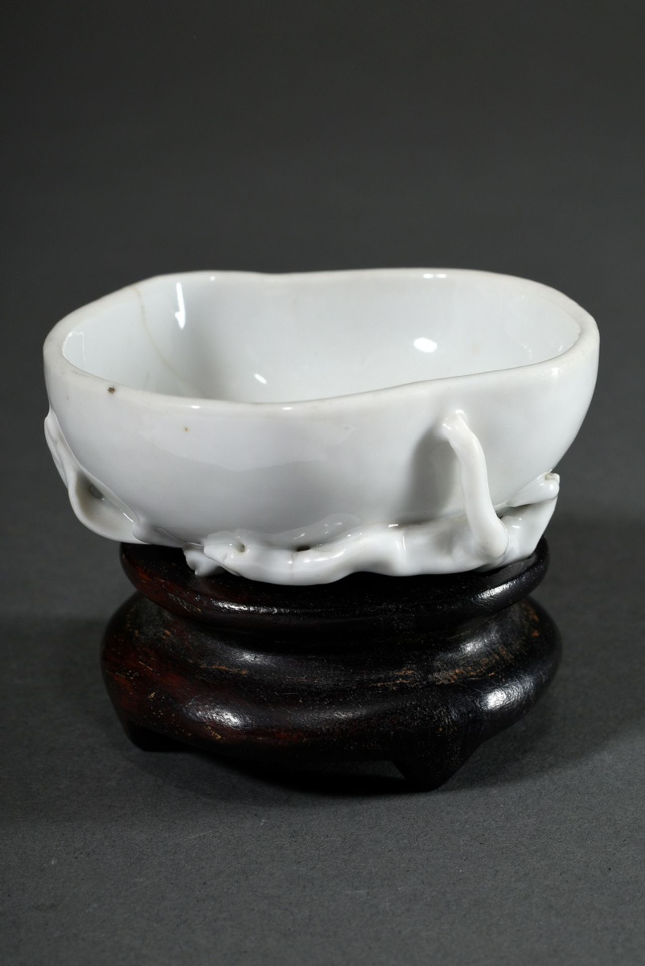 Small Blanc de Chine bowl in peach form on a matching Blackwood base, 18th century, h. 3/6cm, fine 