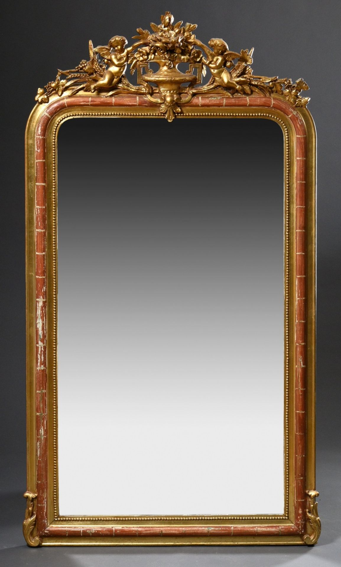 French fireplace mirror with figural decoration "Putti with vase", stucco gilded over bolus ground,