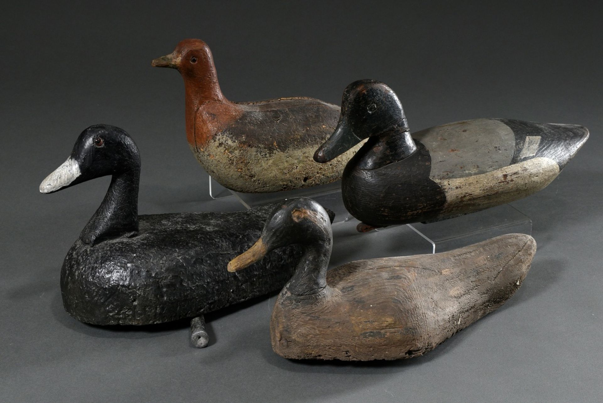 4 Various old decoy ducks, painted wood, 19th c., l. 31-35cm, traces of age