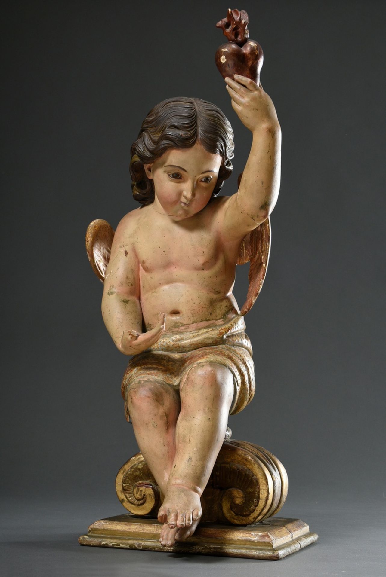 Life-size sacral figure "Angel with the Heart of Jesus" on pedestal, wood coloured and partially gi