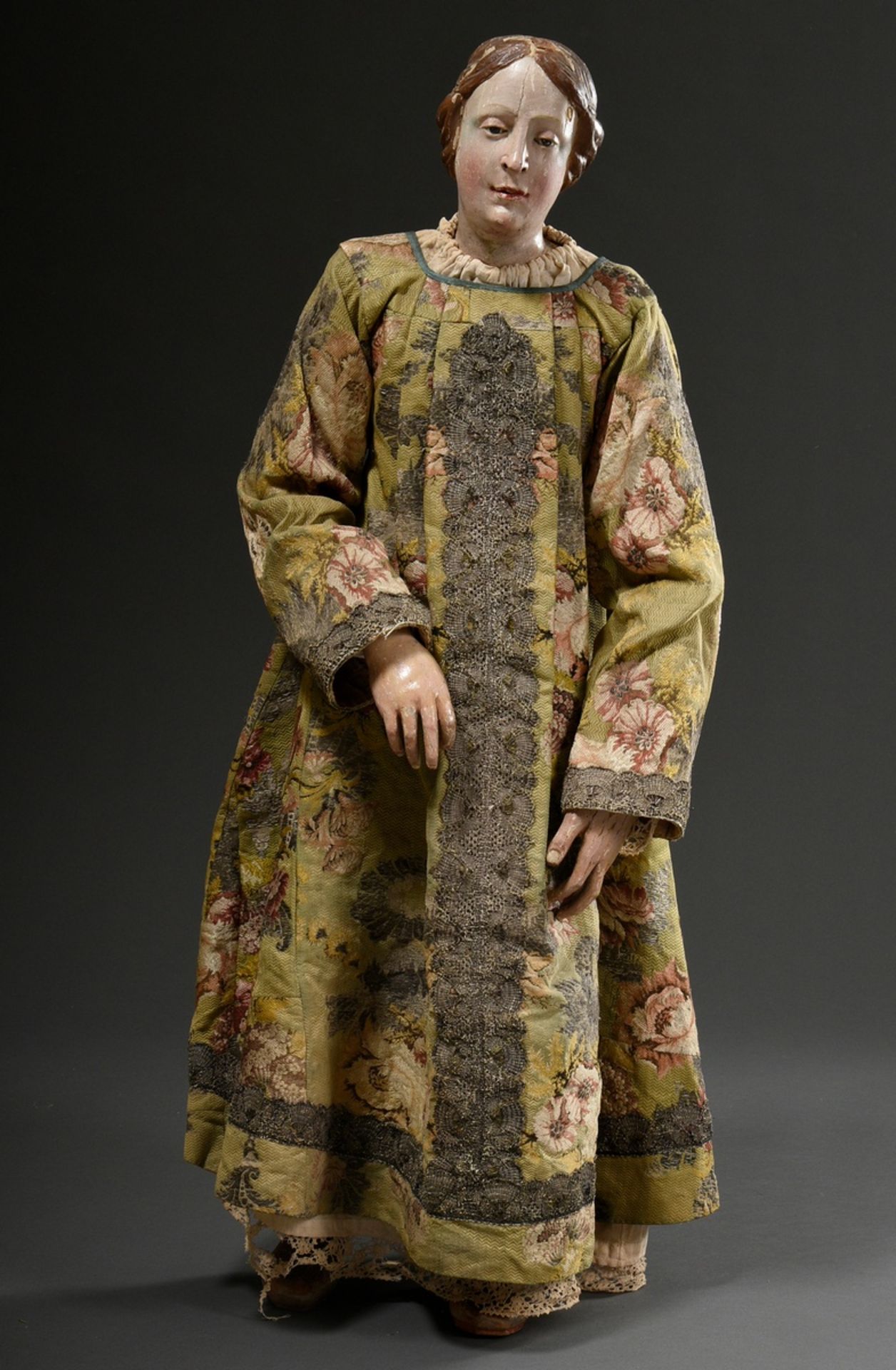 Large processional figure in original clothing with carved wooden body and movable limbs, hands and