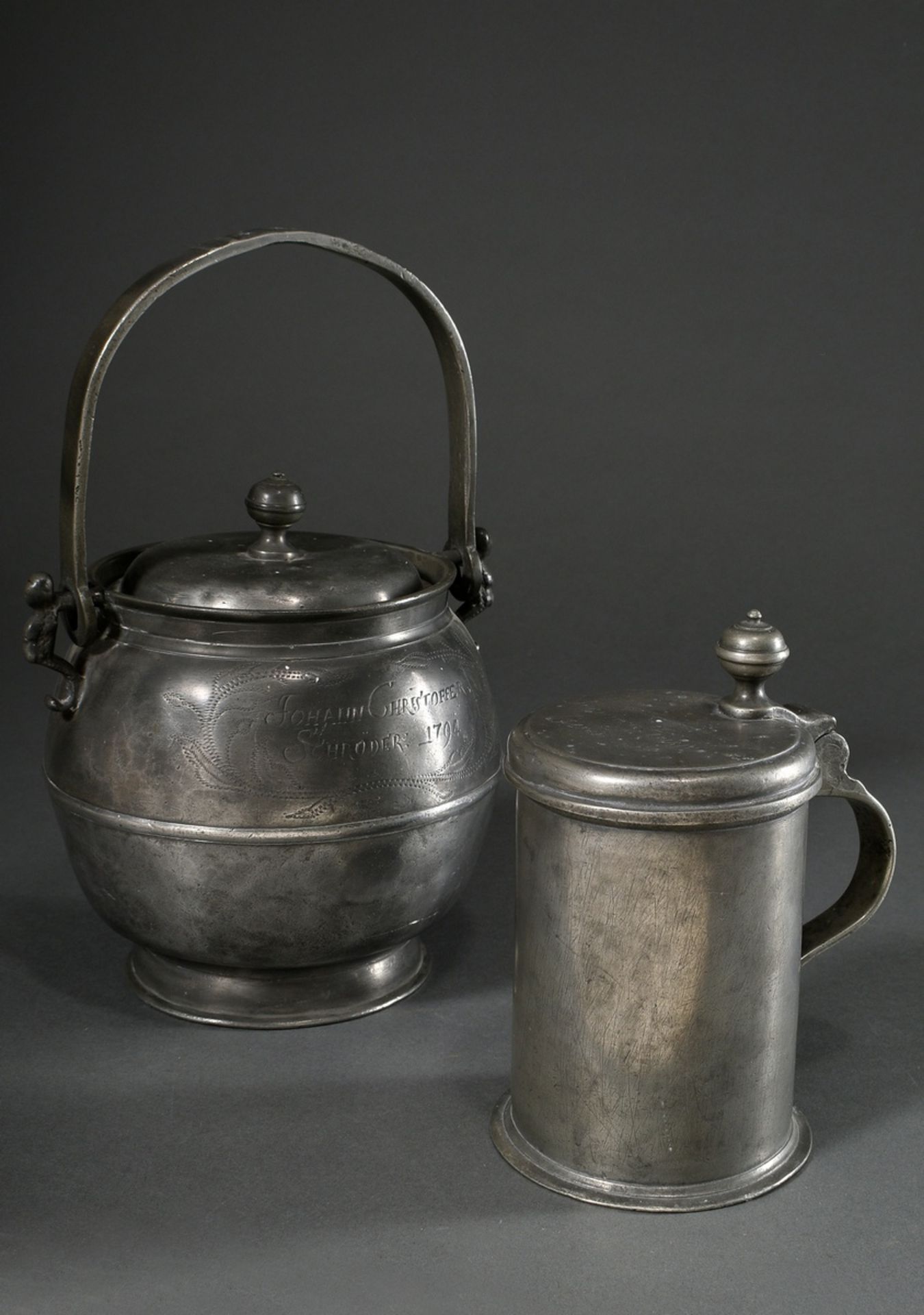 2 Various pieces of Wismar pewter: large hanging pot with figural handles (food carriers) and engra