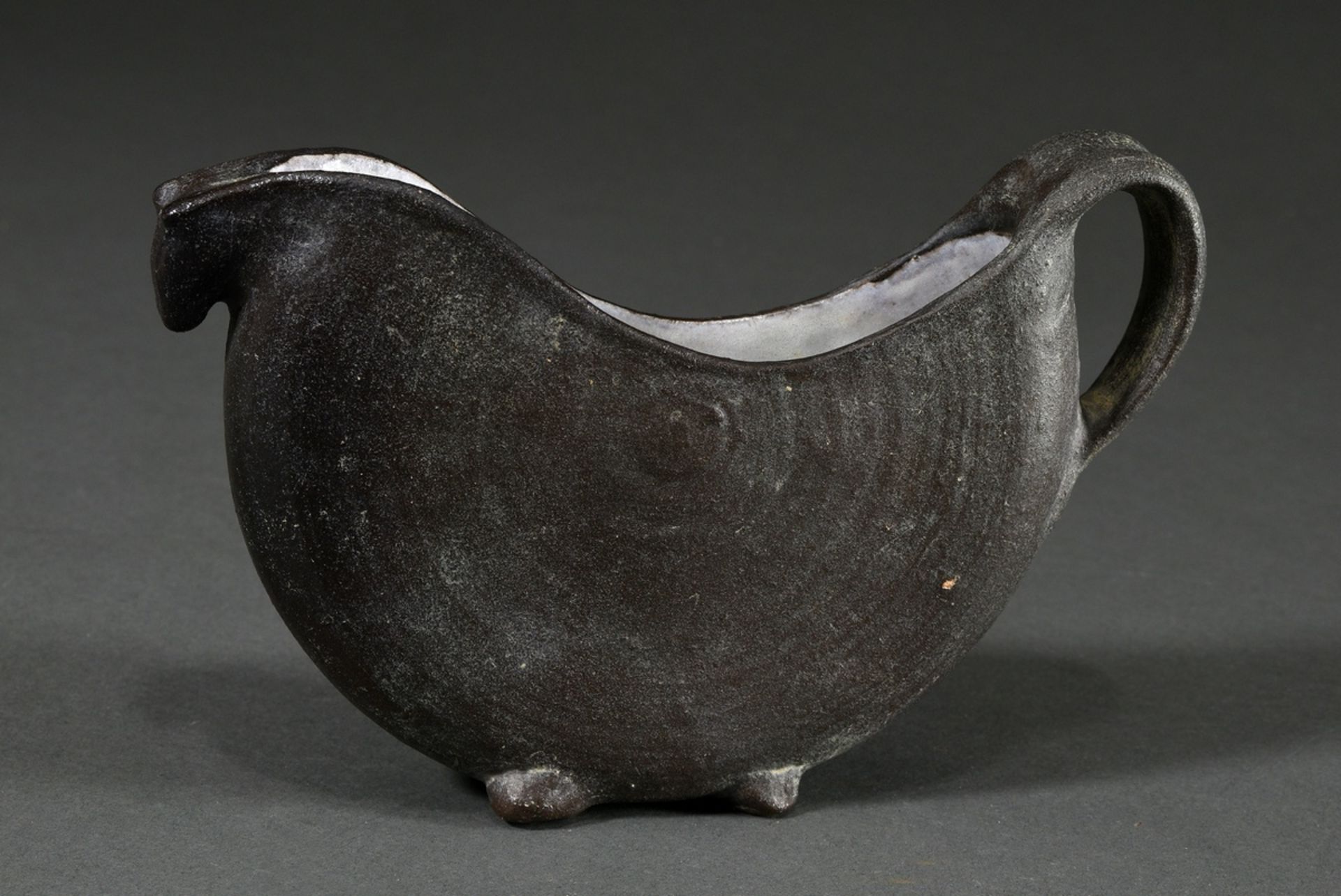 Maetzel, Monika (1917-2010) studio pottery vessel in animal shape with handle, reddish body black/l