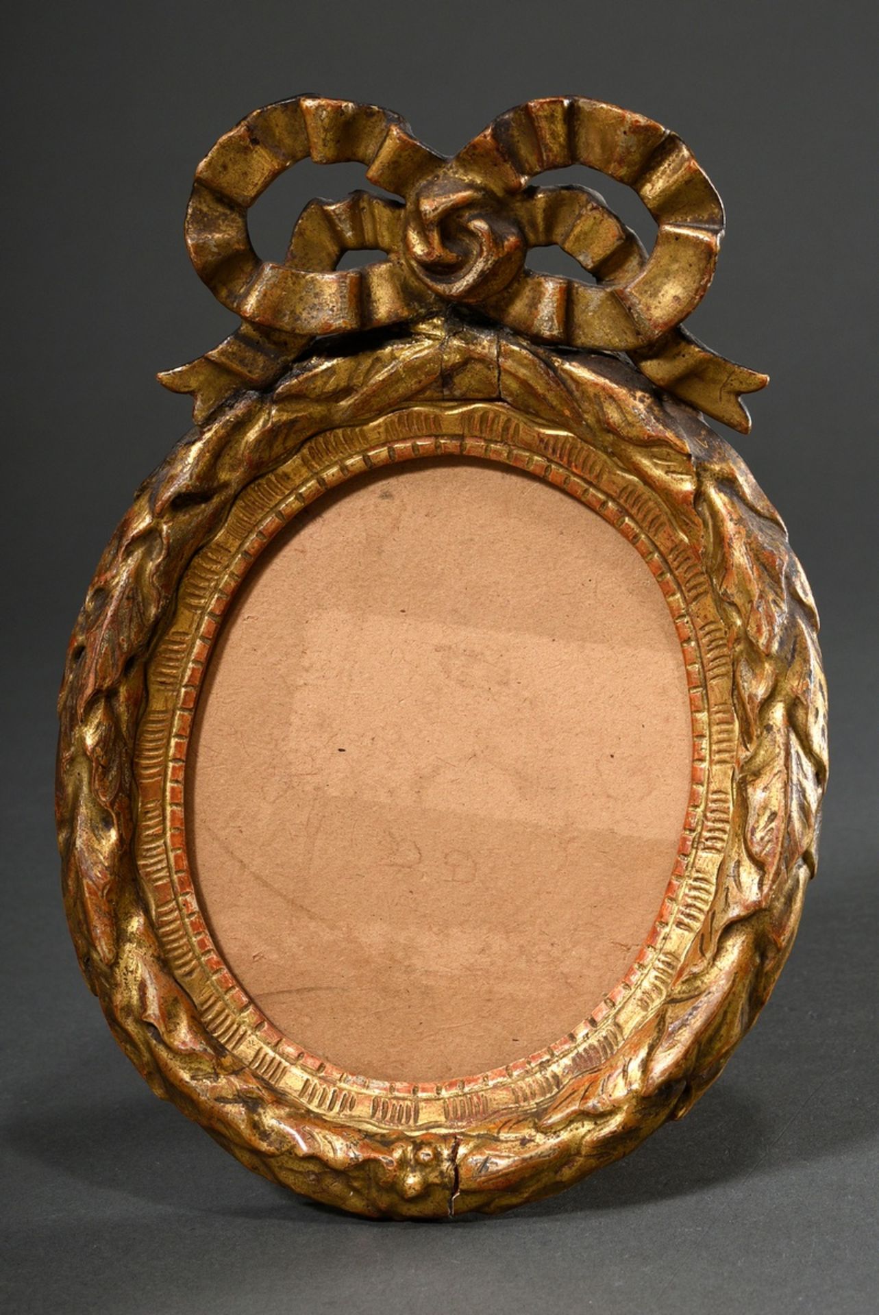 Small Louis XVI frame with laurel border and bow finial, wood carved and gilded, late 18th century,