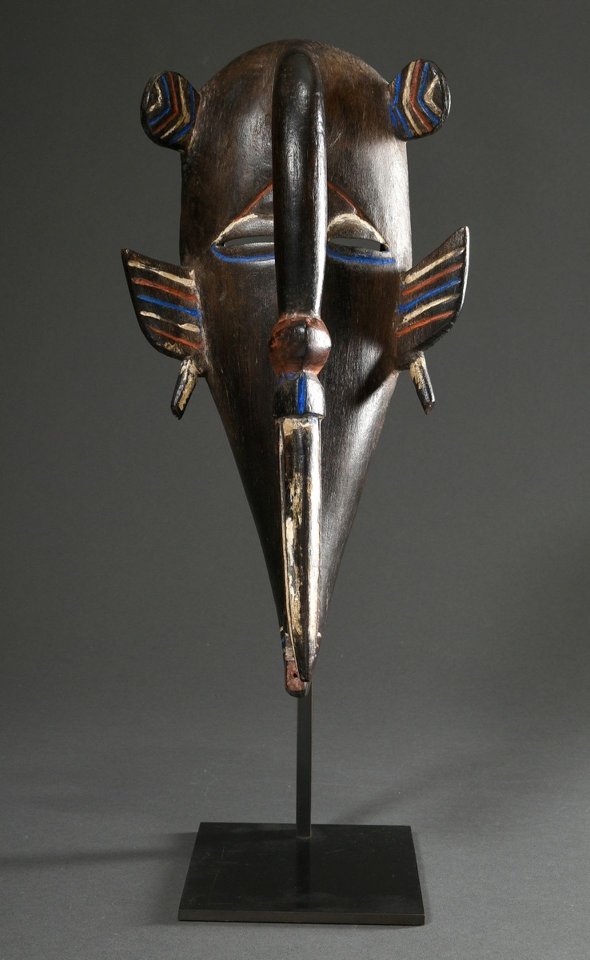 Senufo mask with tapering chin and beak-shaped forehead, carved wood and partially painted blue/whi - Image 3 of 6