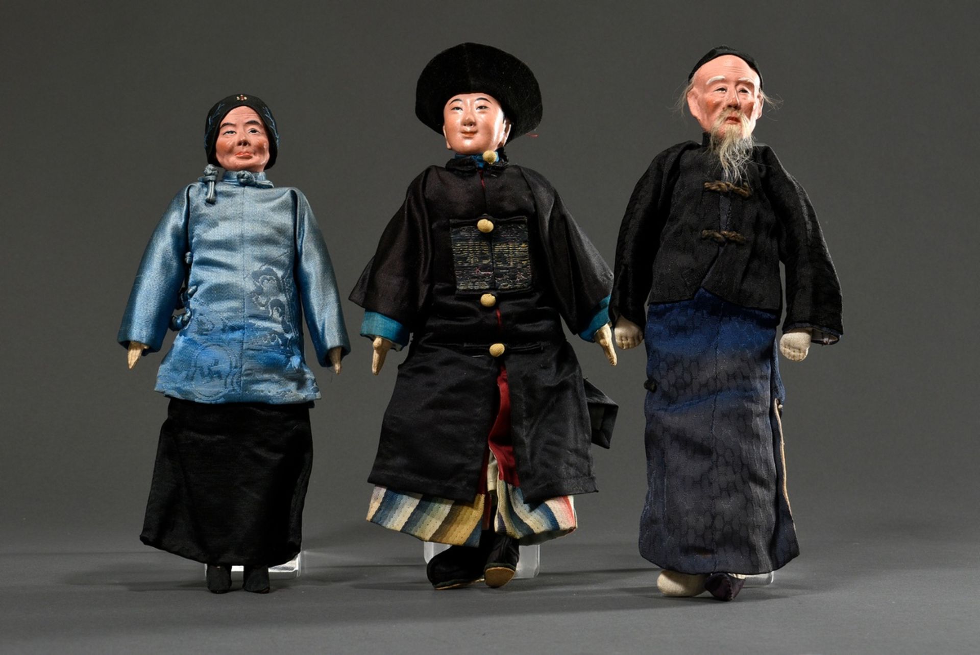 3 Chinese dolls "Mandarin, old man and old woman", cloth body with painted mass heads and partly re