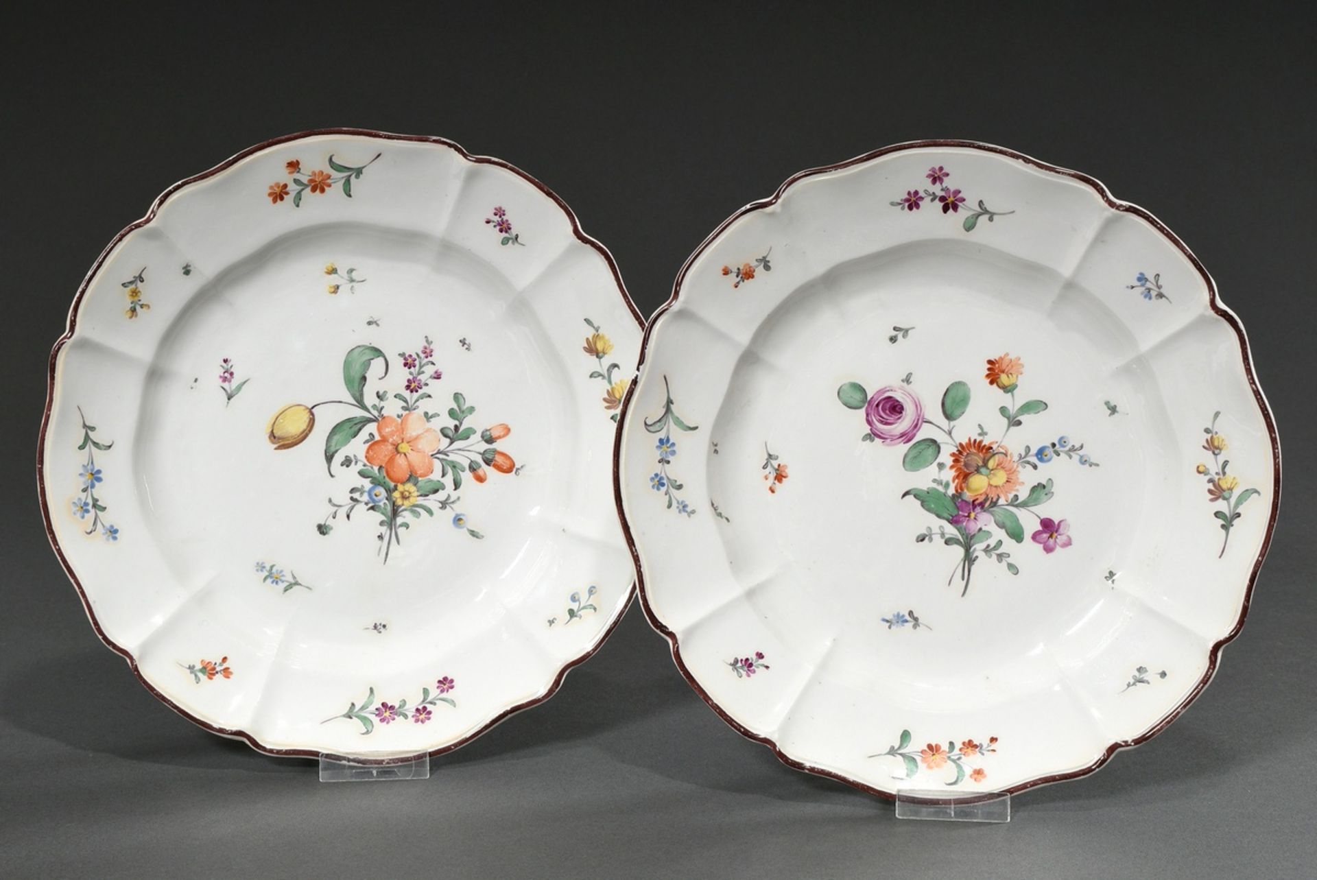 2 Antique porcelain plates with polychrome floral painting and brown rim, 18th century, bottom with