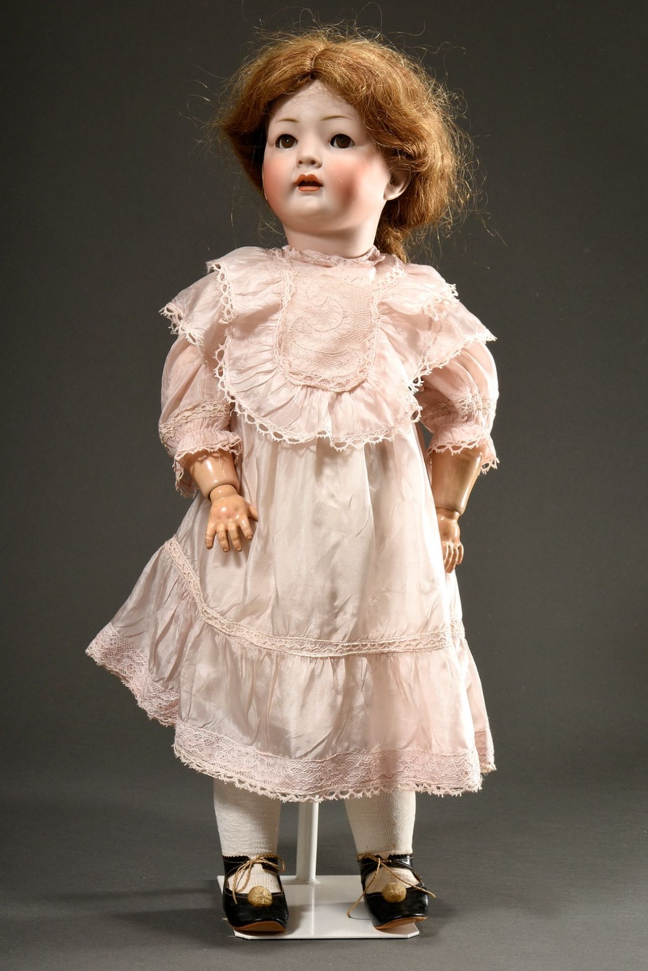 König & Wernicke doll with bisque porcelain crank head, blue sleeping eyes, open mouth with two tee