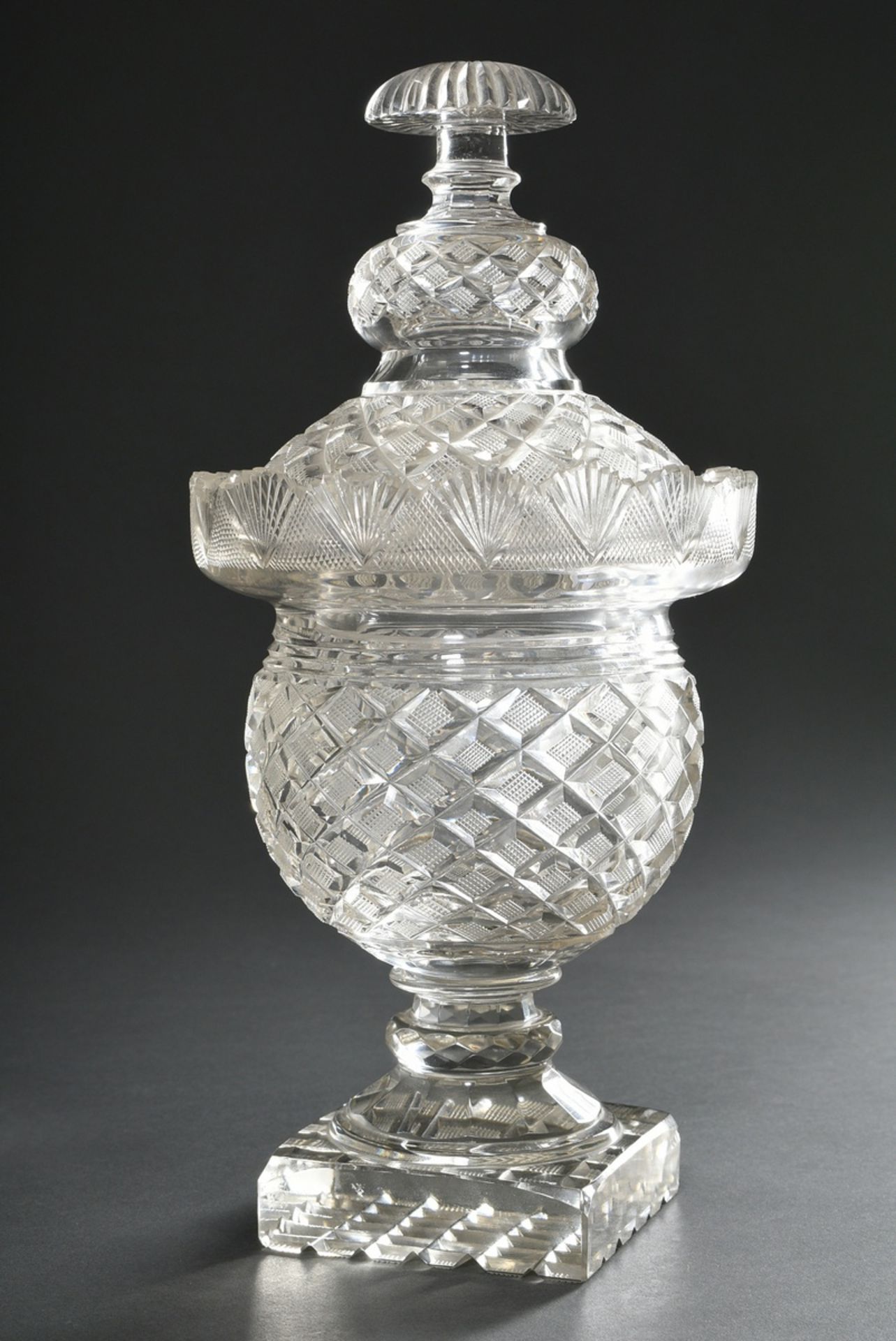 Crystal bonbonniere with rich cut on square base, 19th century, h. 30,5cm, chipped