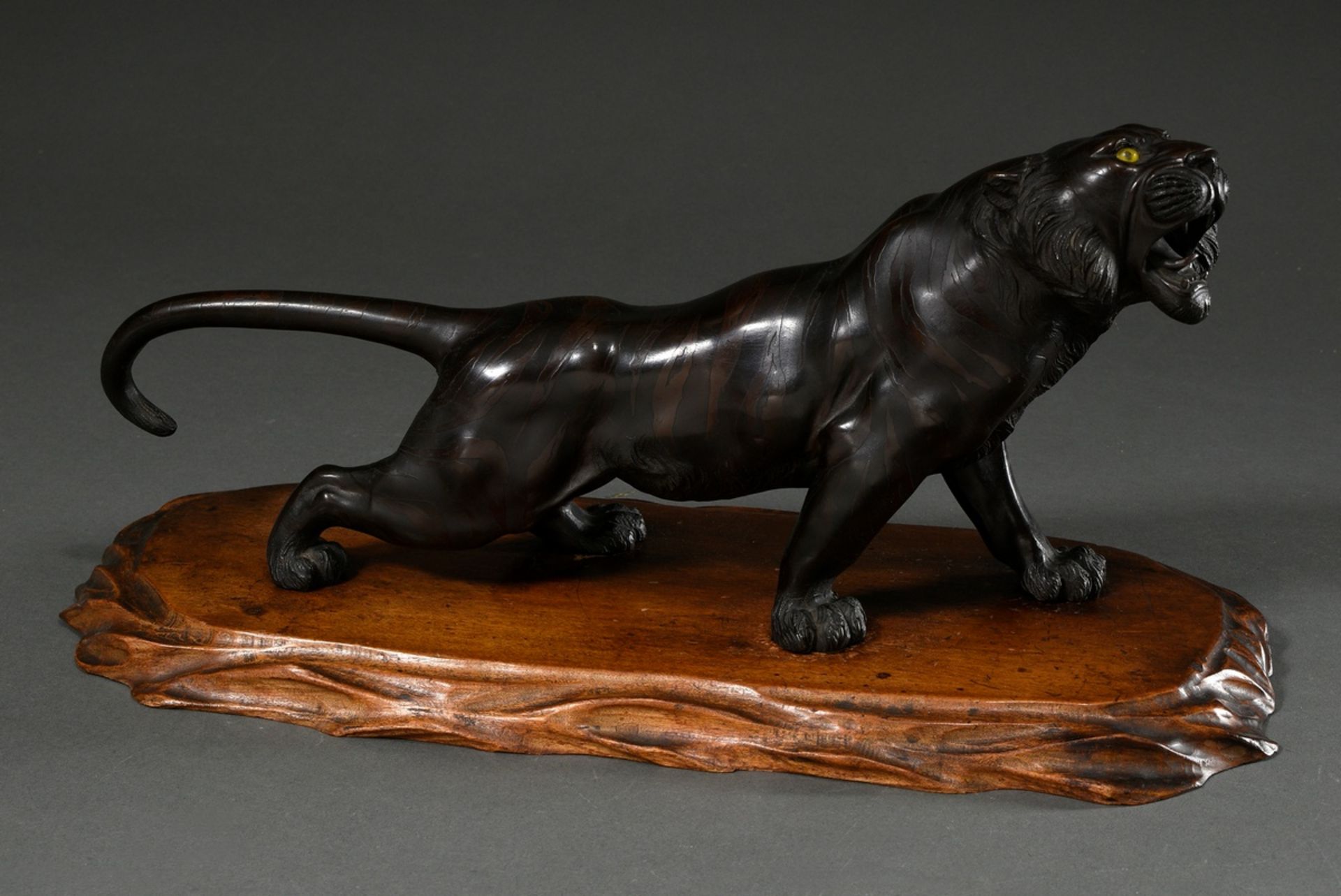 Genryusai Seiya "Roaring Tiger", bronze with yellow glass eyes on wooden base, on the belly signed: