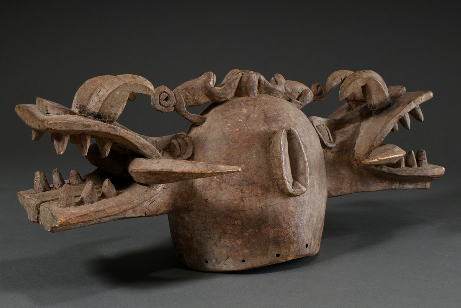 Zoomorphic African helmet mask "Kponyungo" (Firespitter) , carved wood with remains of old patina, 