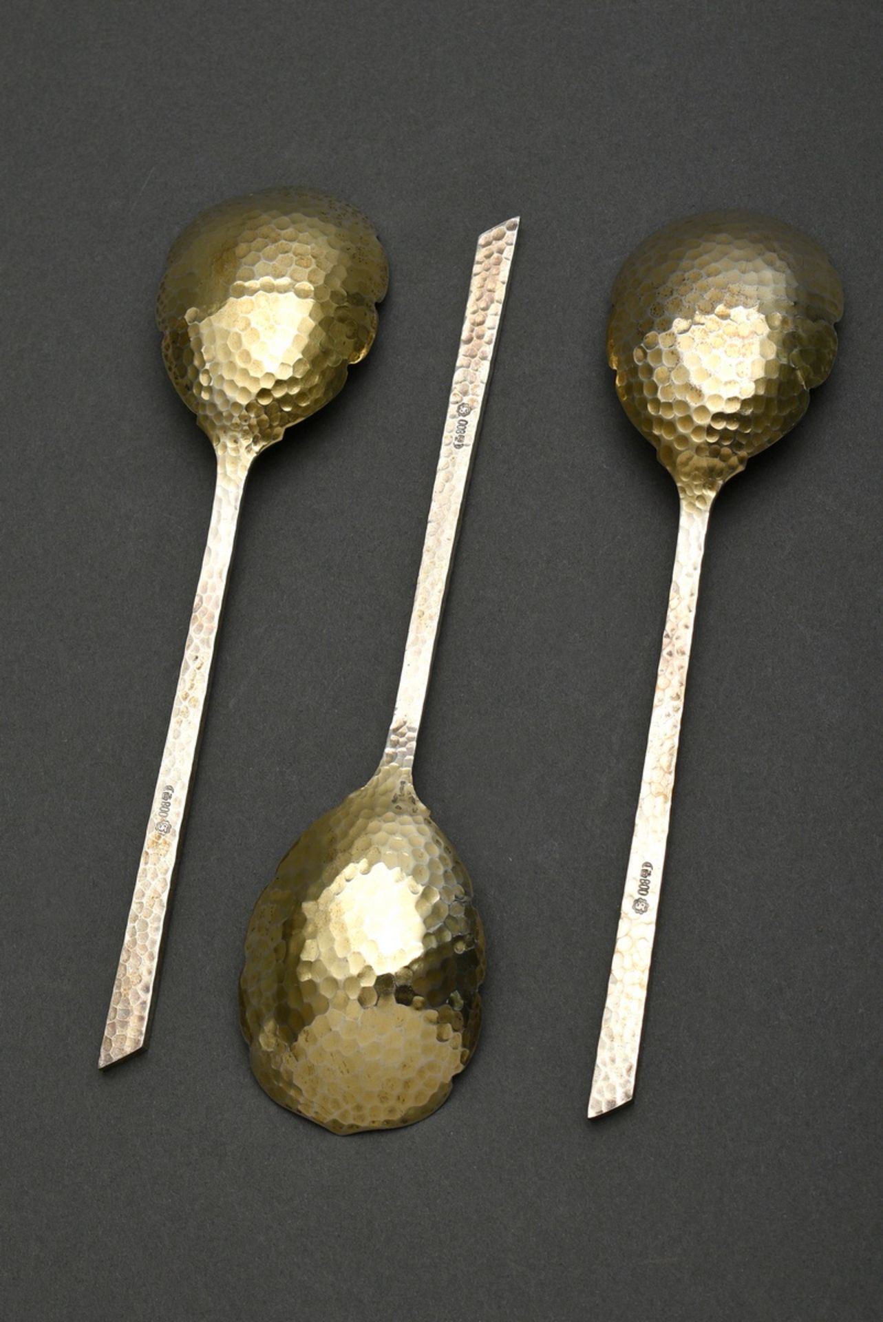 3 Martellated serving spoons with gilded floral lobe and angular handle, MM: Otto Schneider/Berlin, - Image 2 of 2