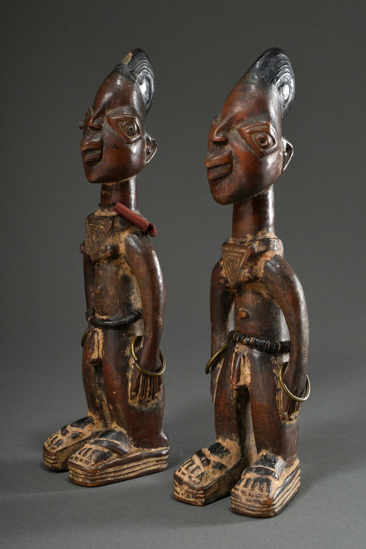 2 Male Yoruba/Abeokuta Ibeji twin figures with pearl jewellery, metal bracelets and separately carv