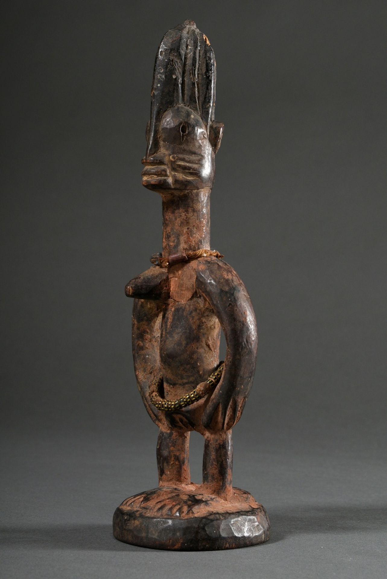Female Yoruba Ibeji figure with beaded jewellery, Nigeria, h. 27cm, 1 breast lost, insect damage