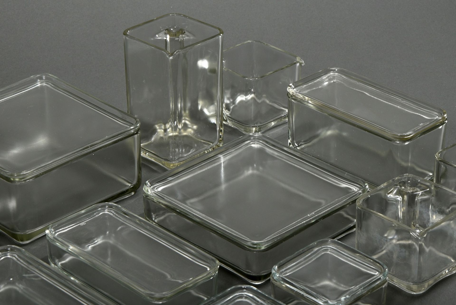 13 Stackable storage jars from the "Kubus-Geschirr", 7 with lids, colourless pressed glass, designe