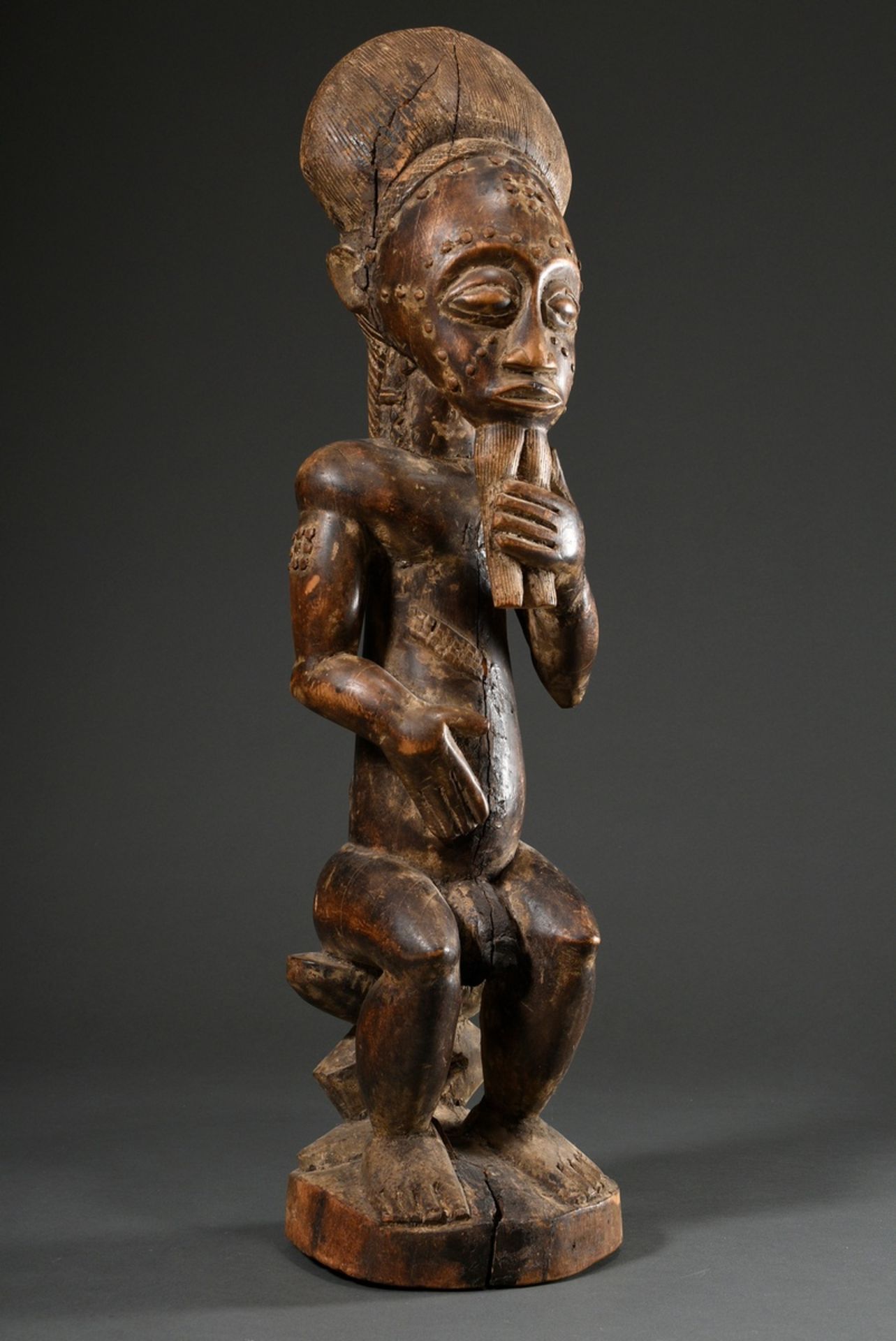 Male African ancestor figure "Blolo bian" with scarifications, carved wood with remains of old pati