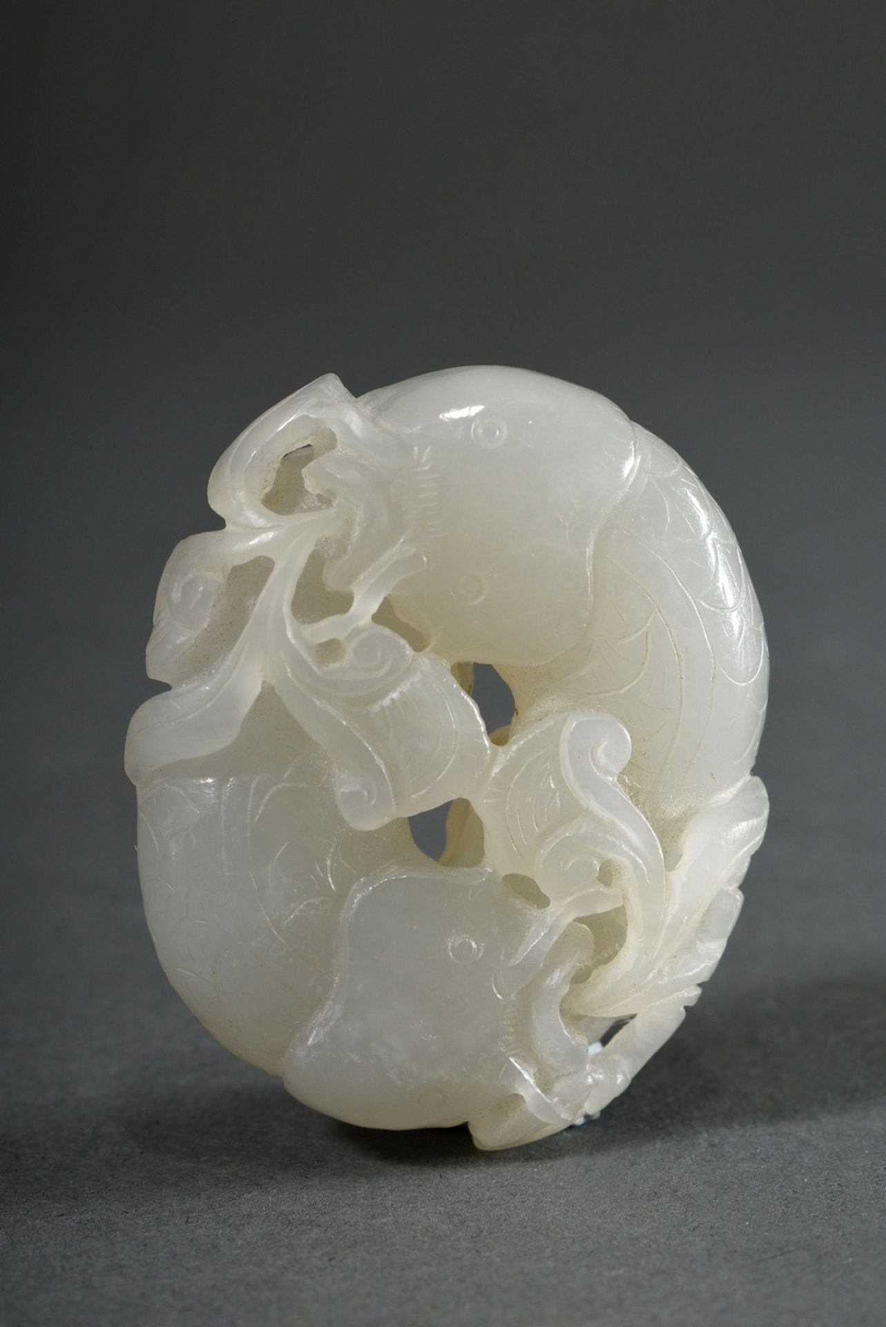 Fine light jade toggle "Two catfish and plants", China, Qing period, wooden stand, 5.3x4.2x1.5cm - Image 4 of 4