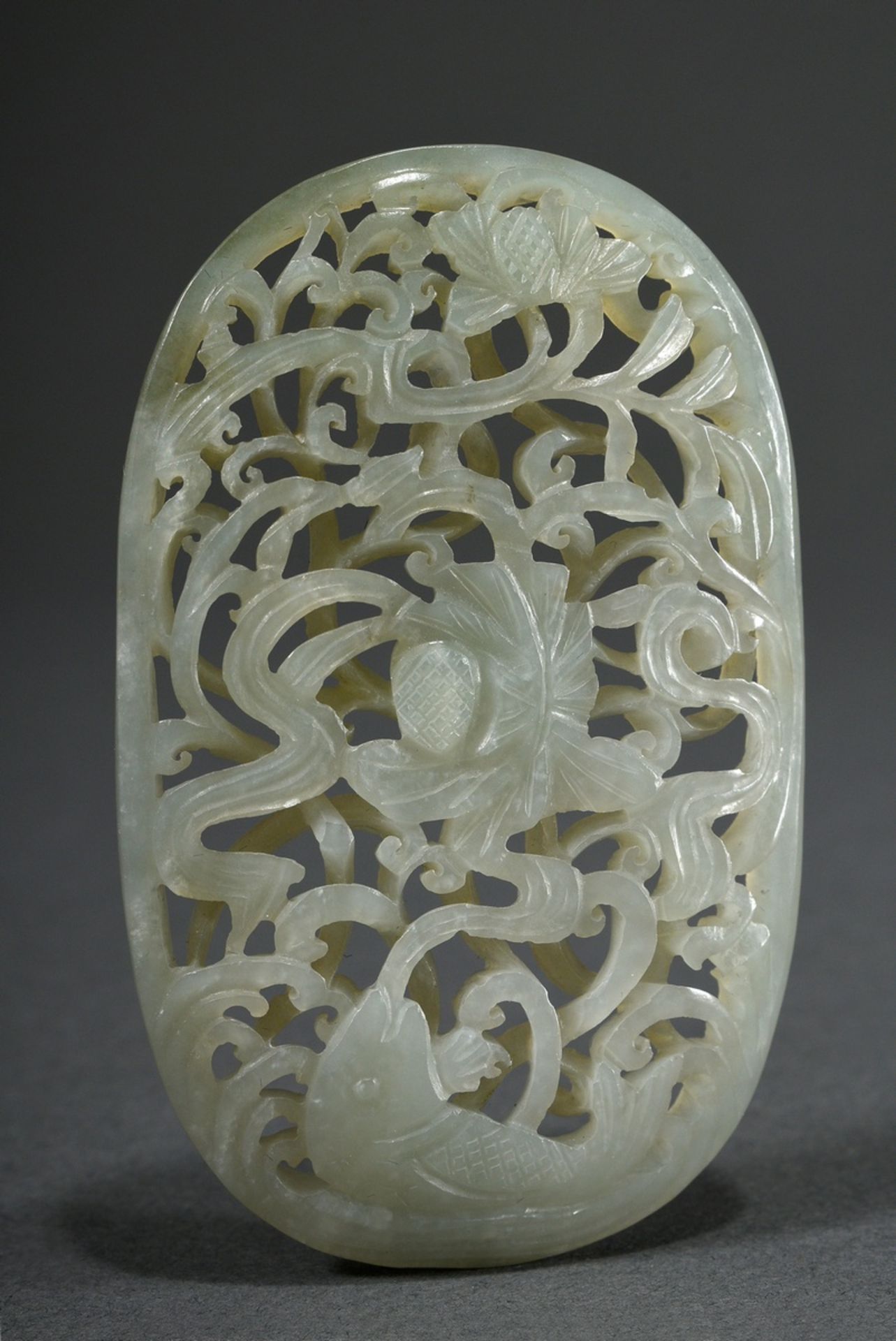 Elliptical celadonjade badge in Ming style "Carp in lotus pond" in very fine carving on two levels,