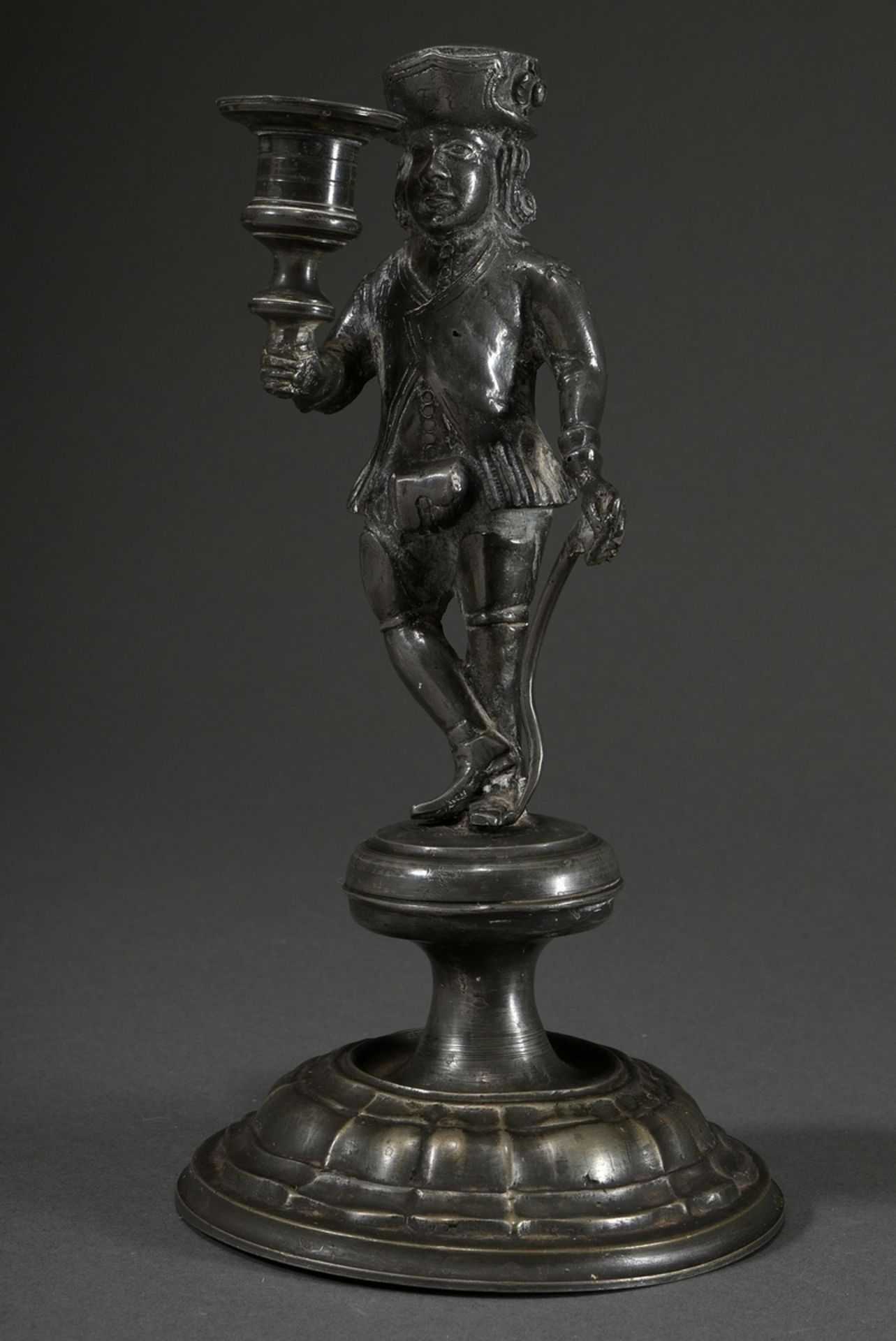 Pewter miner's candlestick with massive fully plastic miner's figure with candle socket in the righ