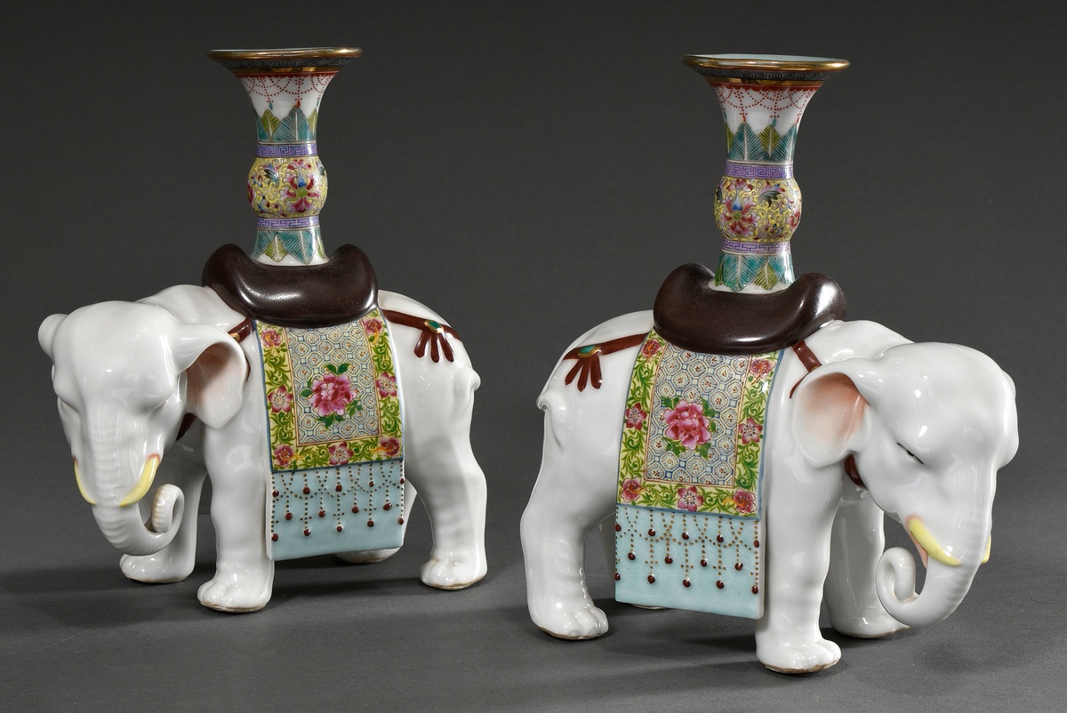 Pair of porcelain figures "White elephants with saddle cloth and vase" with Famille Rose painting,