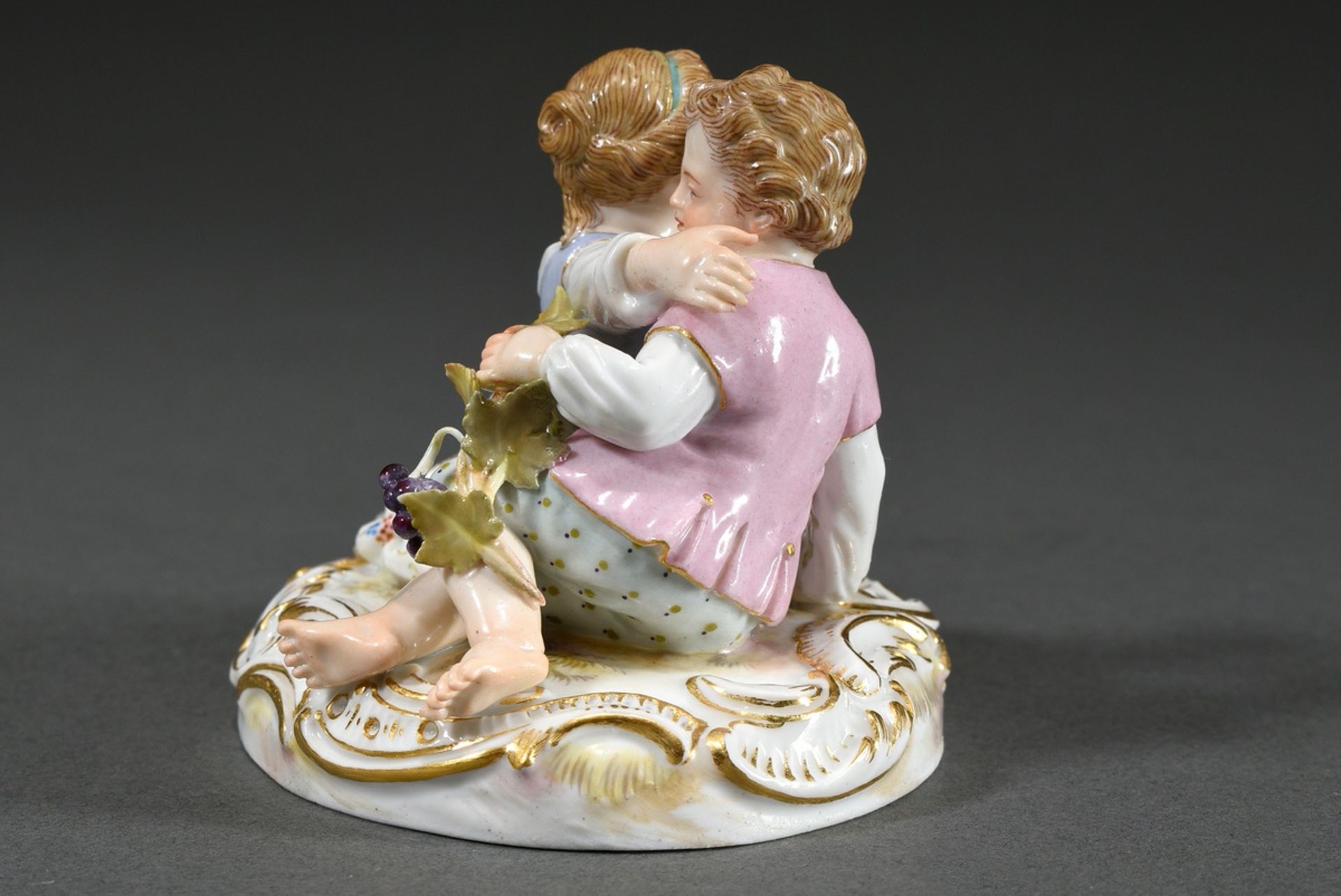 Small Meissen group "Two Children with Grapes", a boy and a girl sitting on an oval rocaille base f - Image 3 of 7