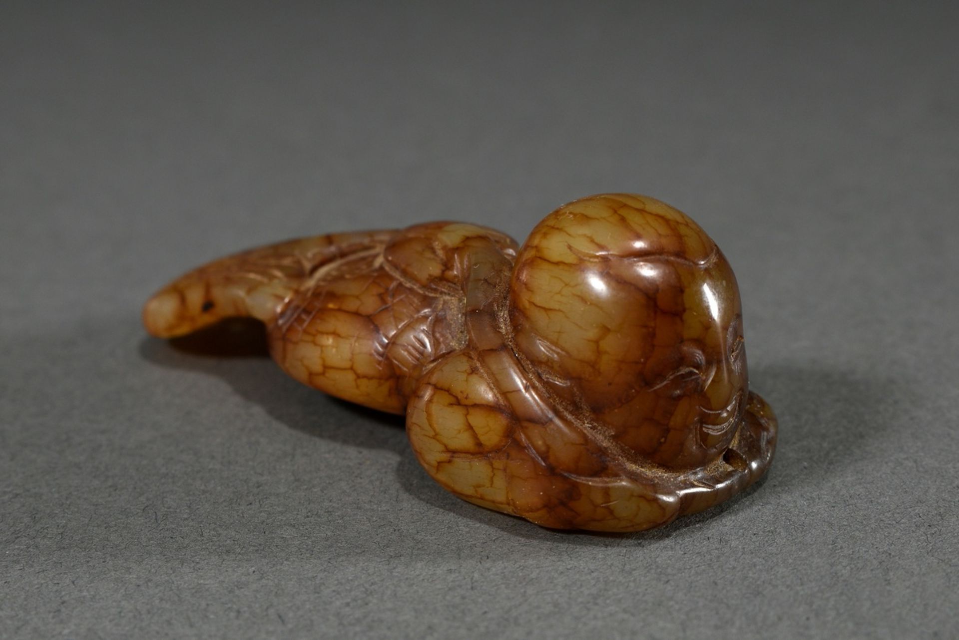 Fine figure of brown veined jade "Lying Mermaid", Ming or later, China, l. 7.5cm