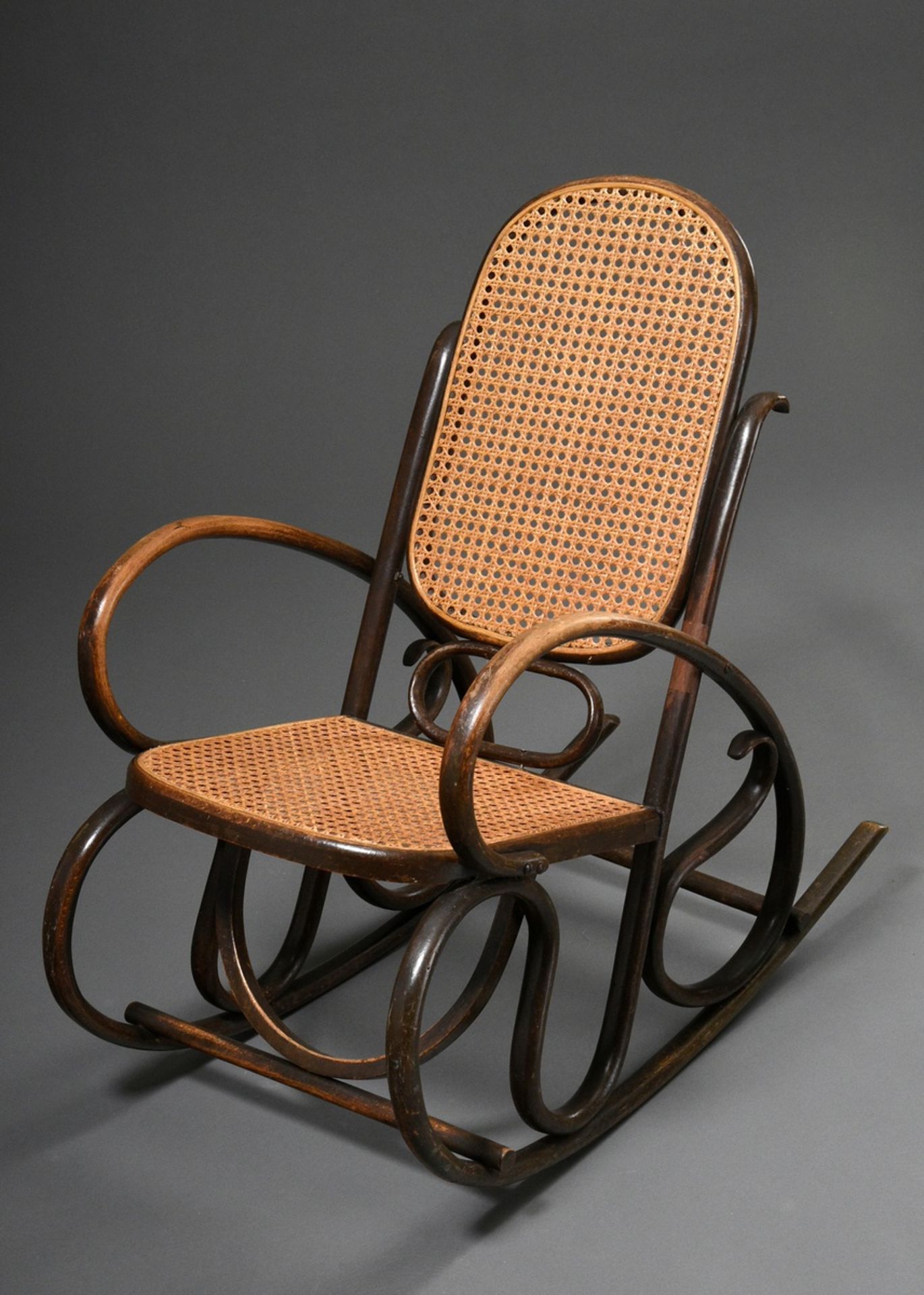 Art nouveau children's rocking chair in Thonet style, dark stained bentwood with wickerwork, h. 71,