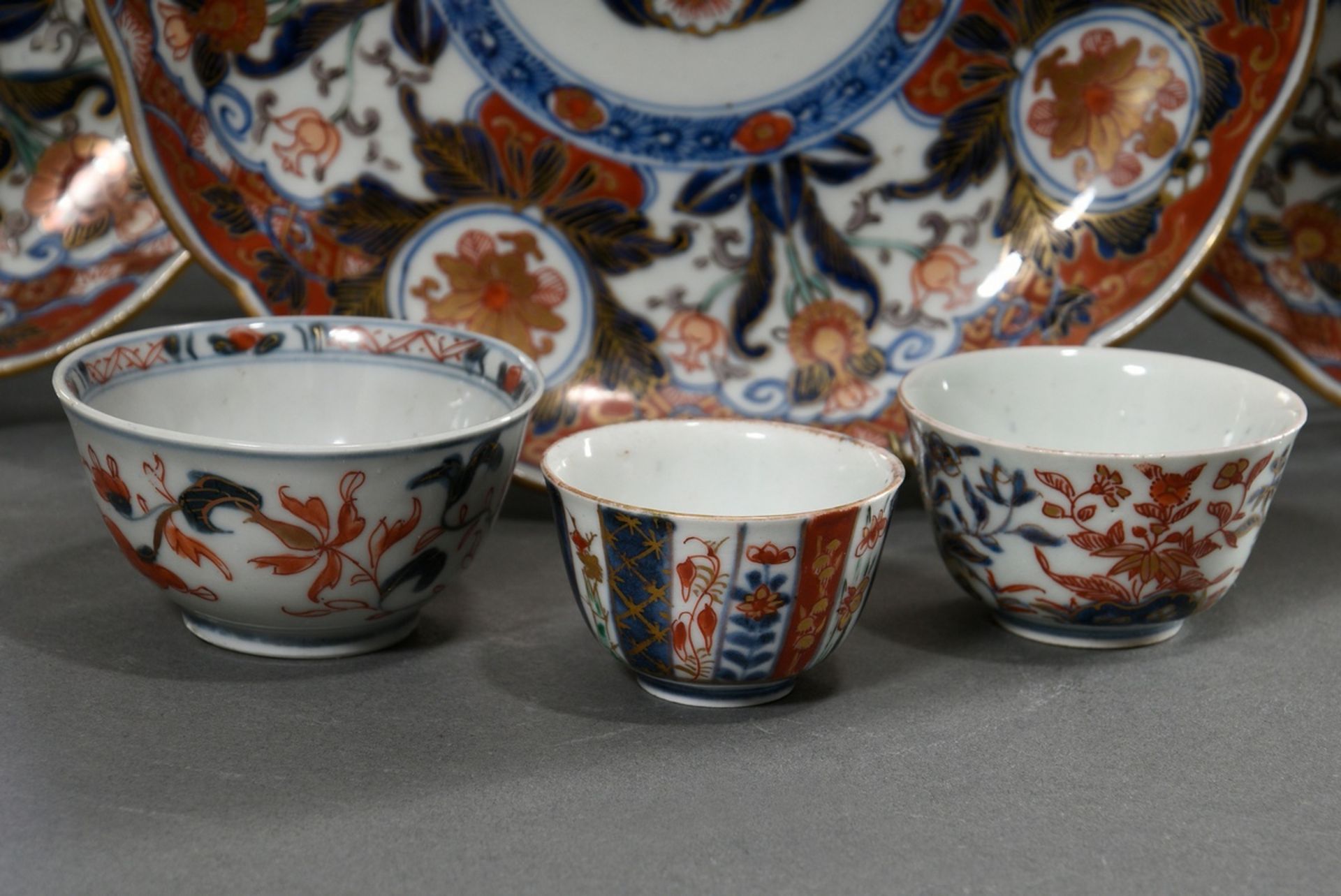7 Various Japanese porcelains with Imari décor in underglaze blue, iron red and gold: 3 various sak - Image 2 of 8