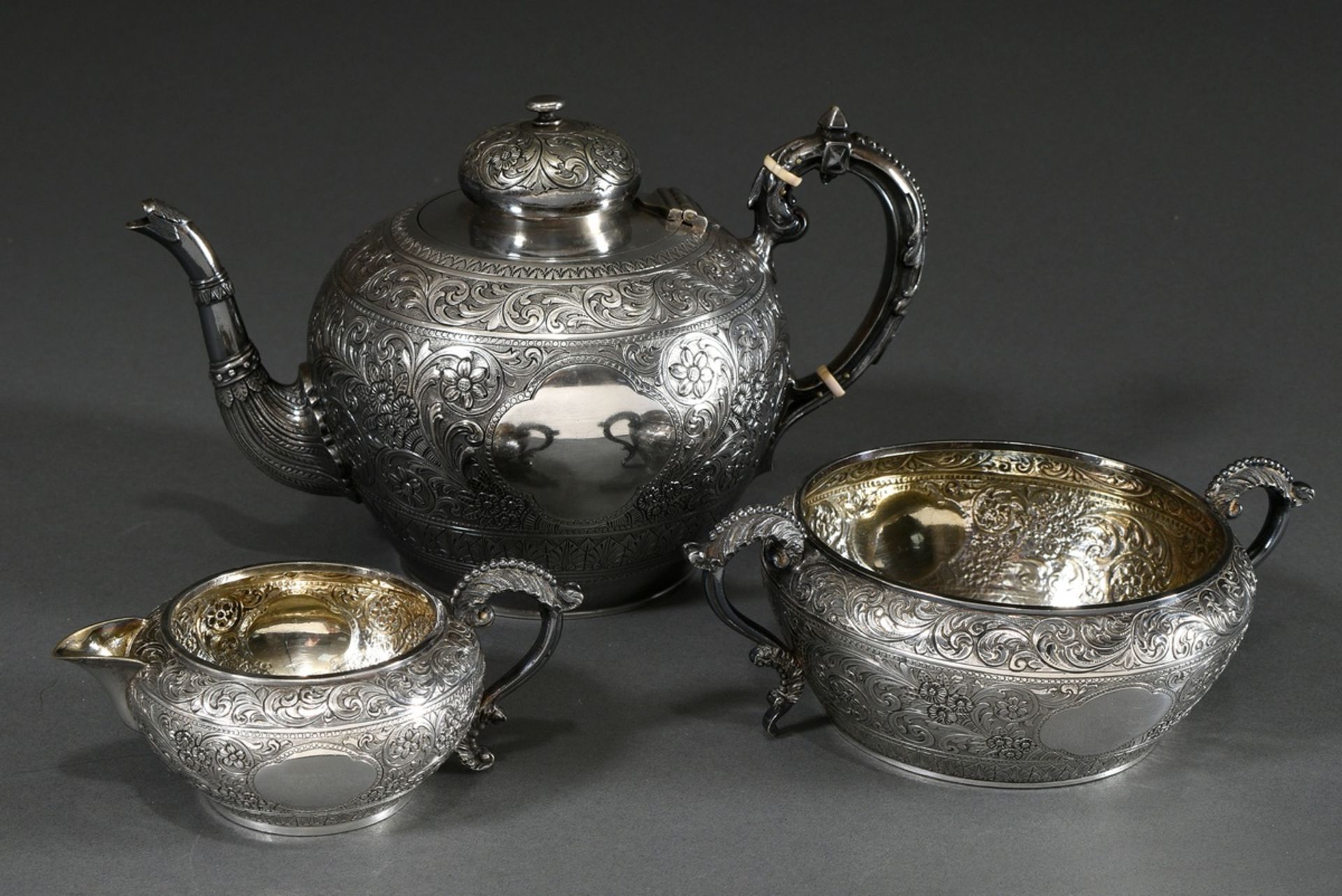 3 Pieces English tea set with rich floral-ornamental engraving after oriental model, Mappin & Webb/