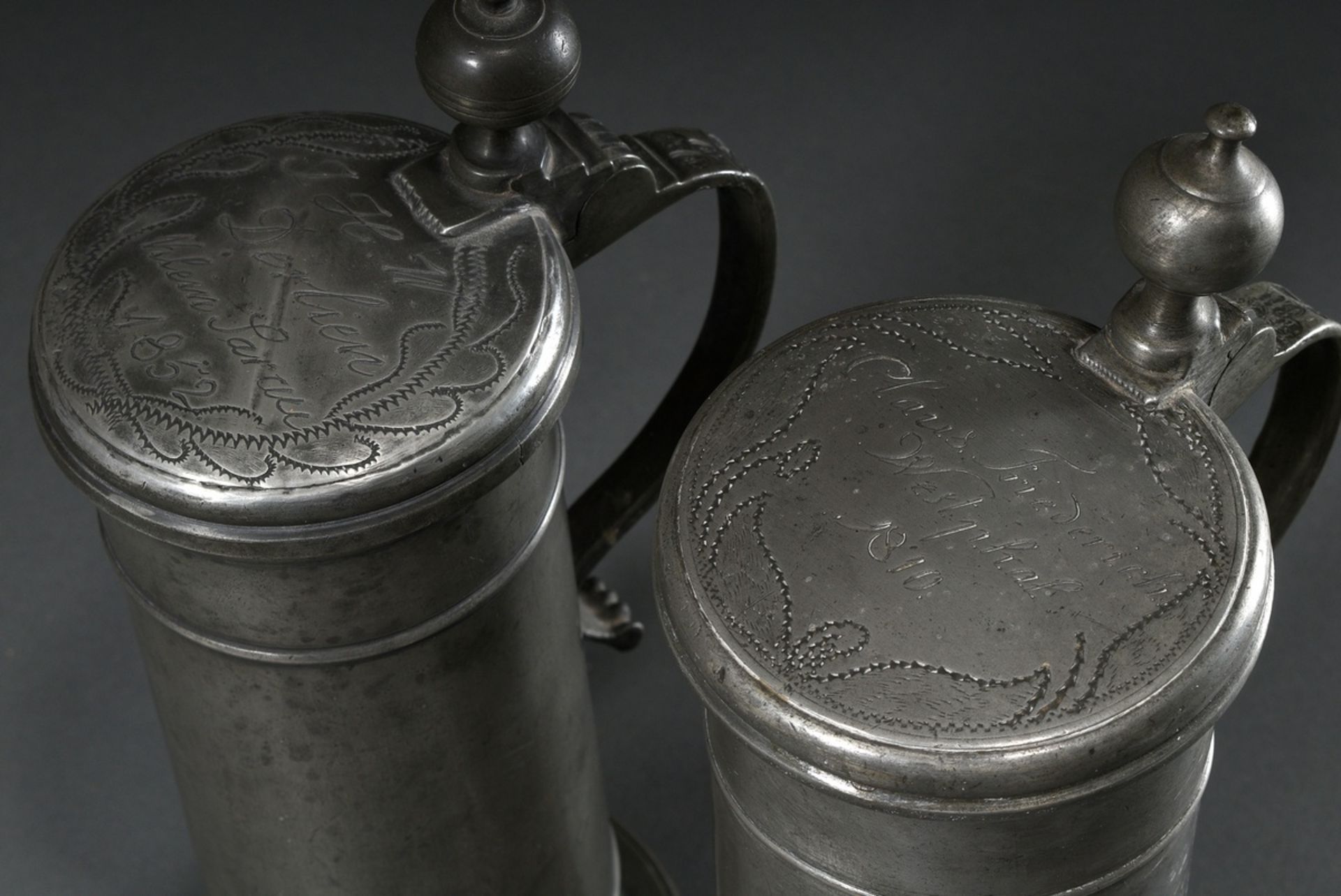 2 Diverse Lübeck pewter pillar jugs or tap seats with spherical thumb rest, ornamental relief on th - Image 2 of 8
