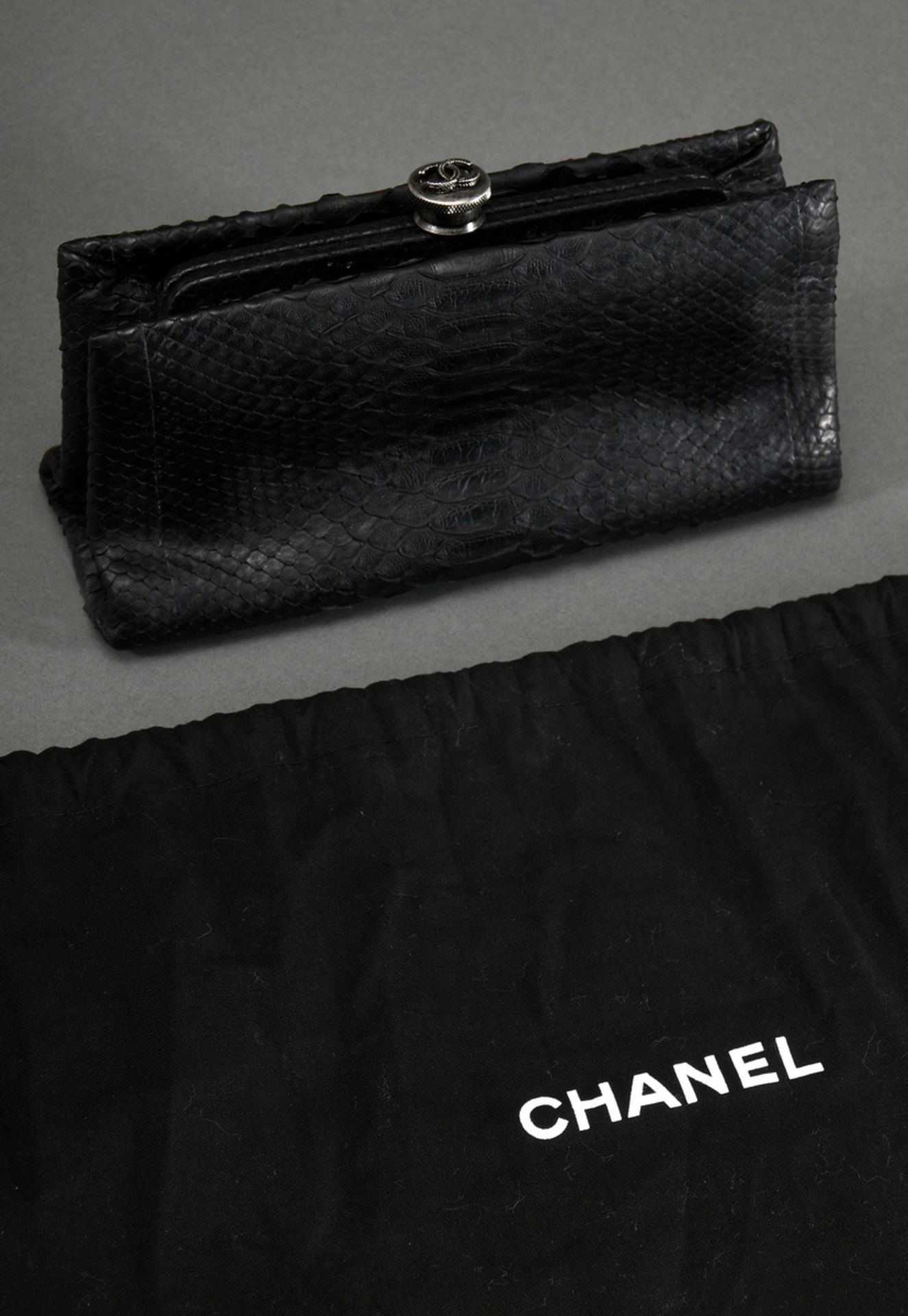 Chanel clutch in black python leather with silver metal logo clasp, black silk lining, Collection 2