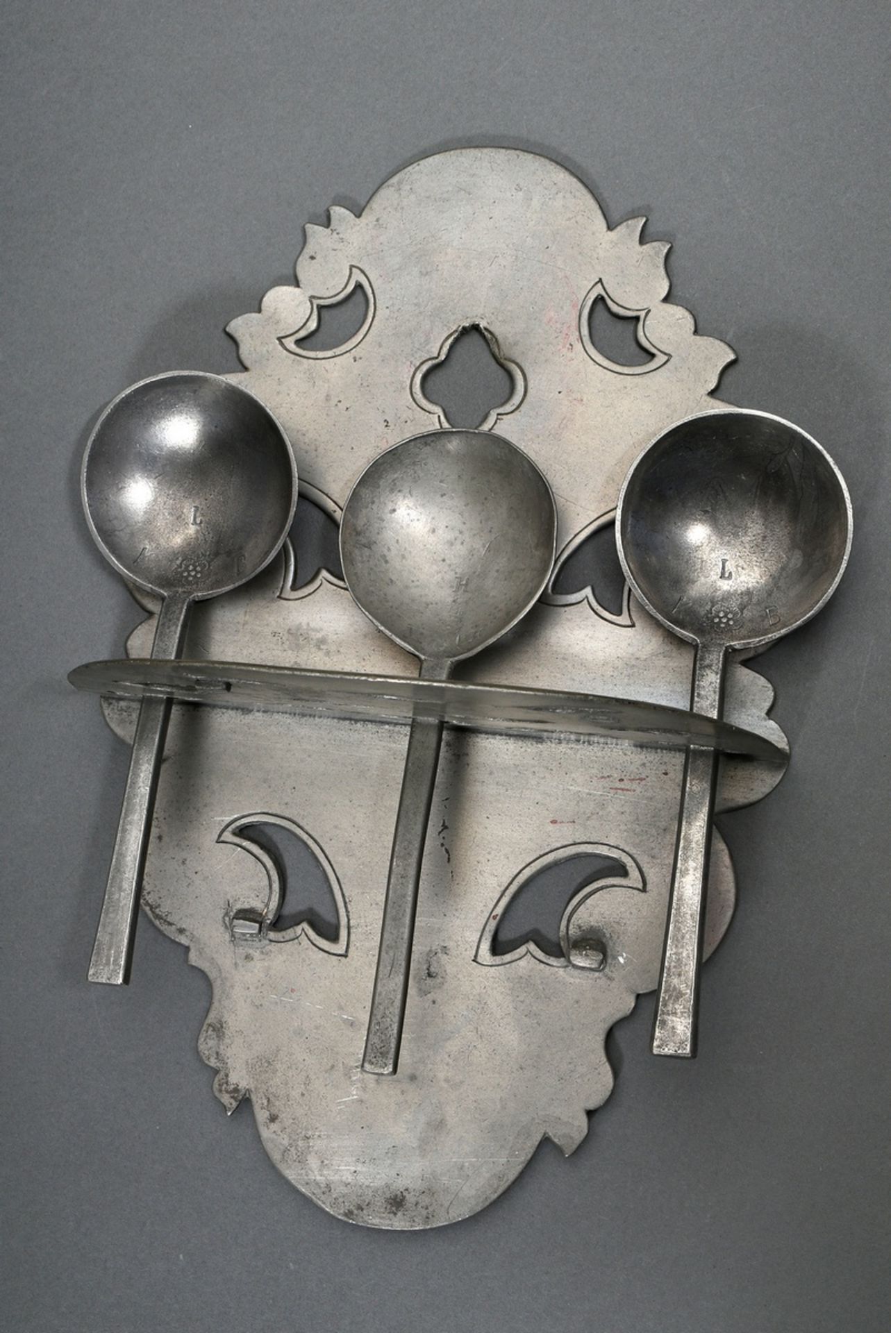 Pewter spoon board in openwork shield form with 12 slots, MZ indistinct, end of 18th century, 31x20
