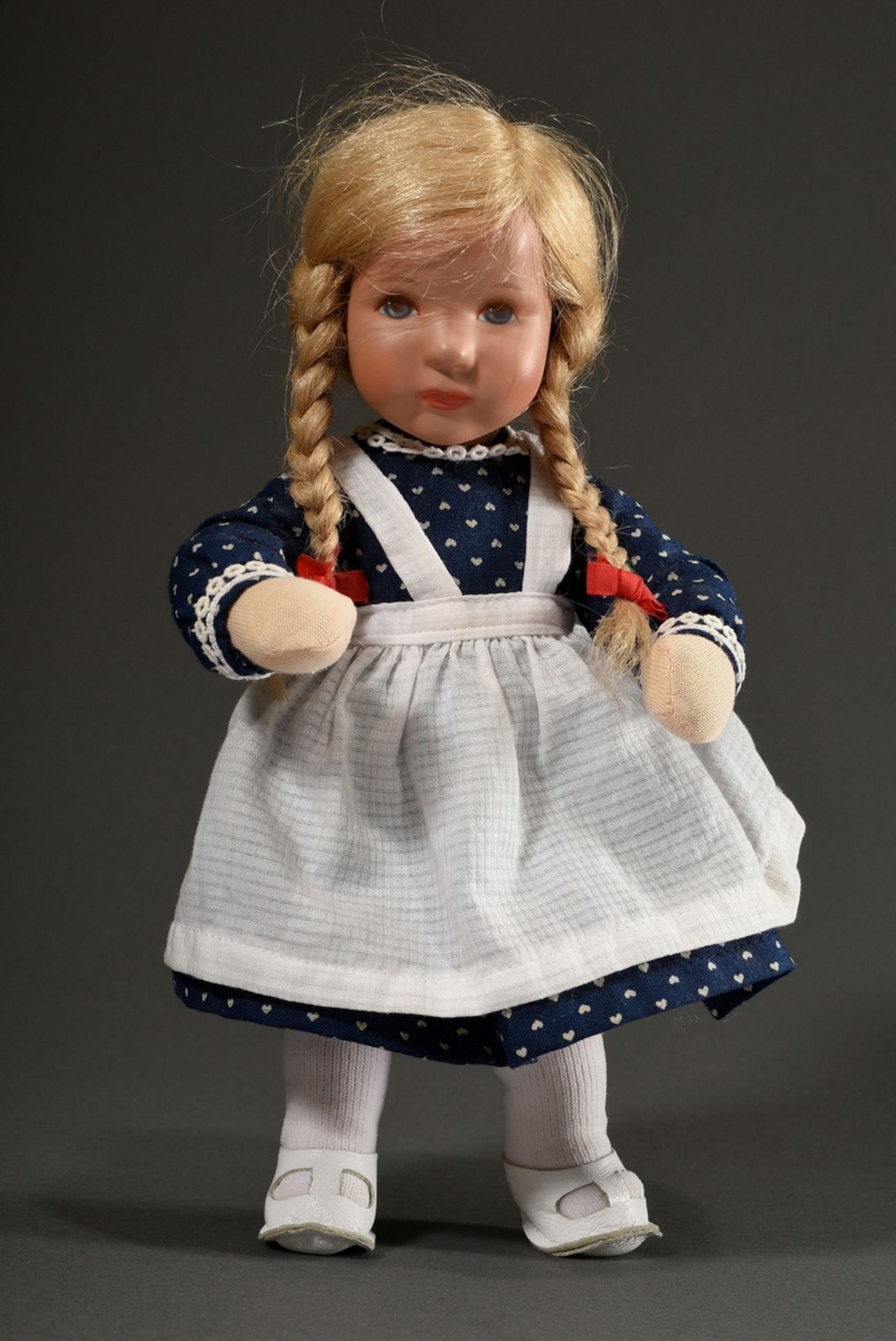 Small Käthe Kruse doll with bendable body, blond real hair and painted blue eyes, around 1970, l. 2