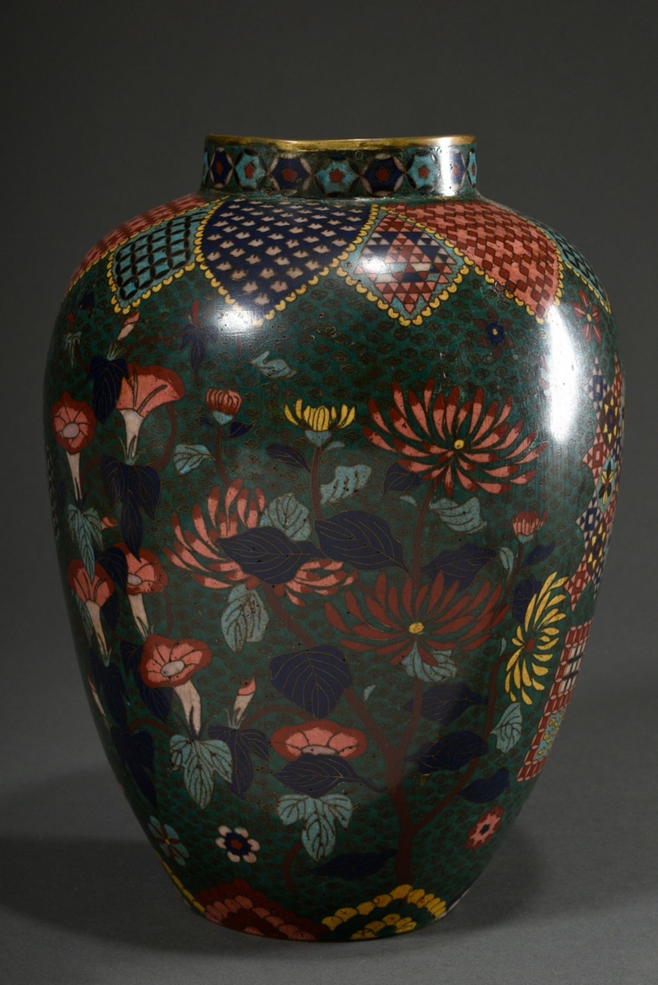 Large cloisonné shoulder vase with floral and geometric decoration in dark shades on a dark green b