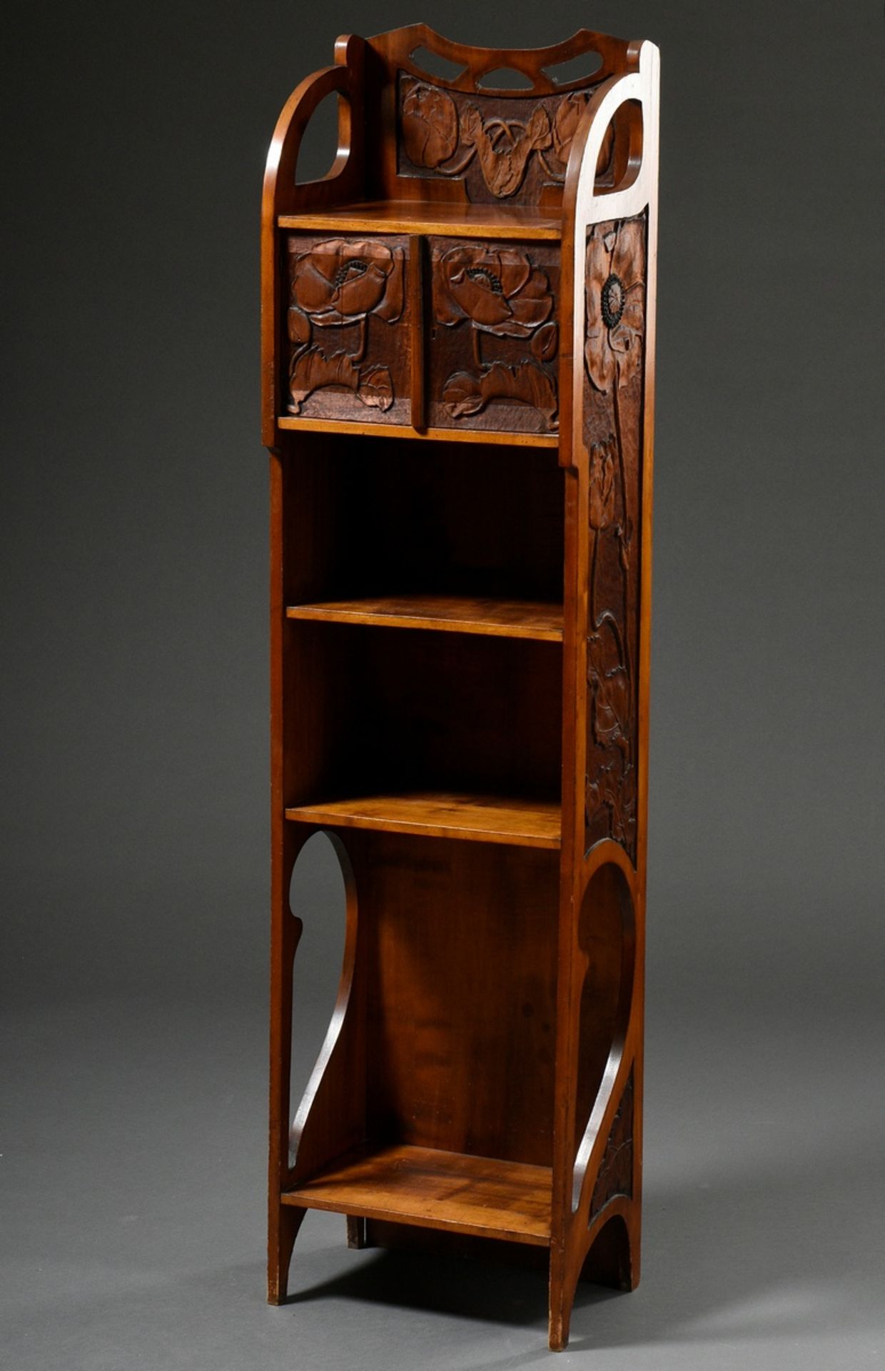 Narrow Art Nouveau shelf with two-door compartment and ornamentally carved frame as well as "poppy
