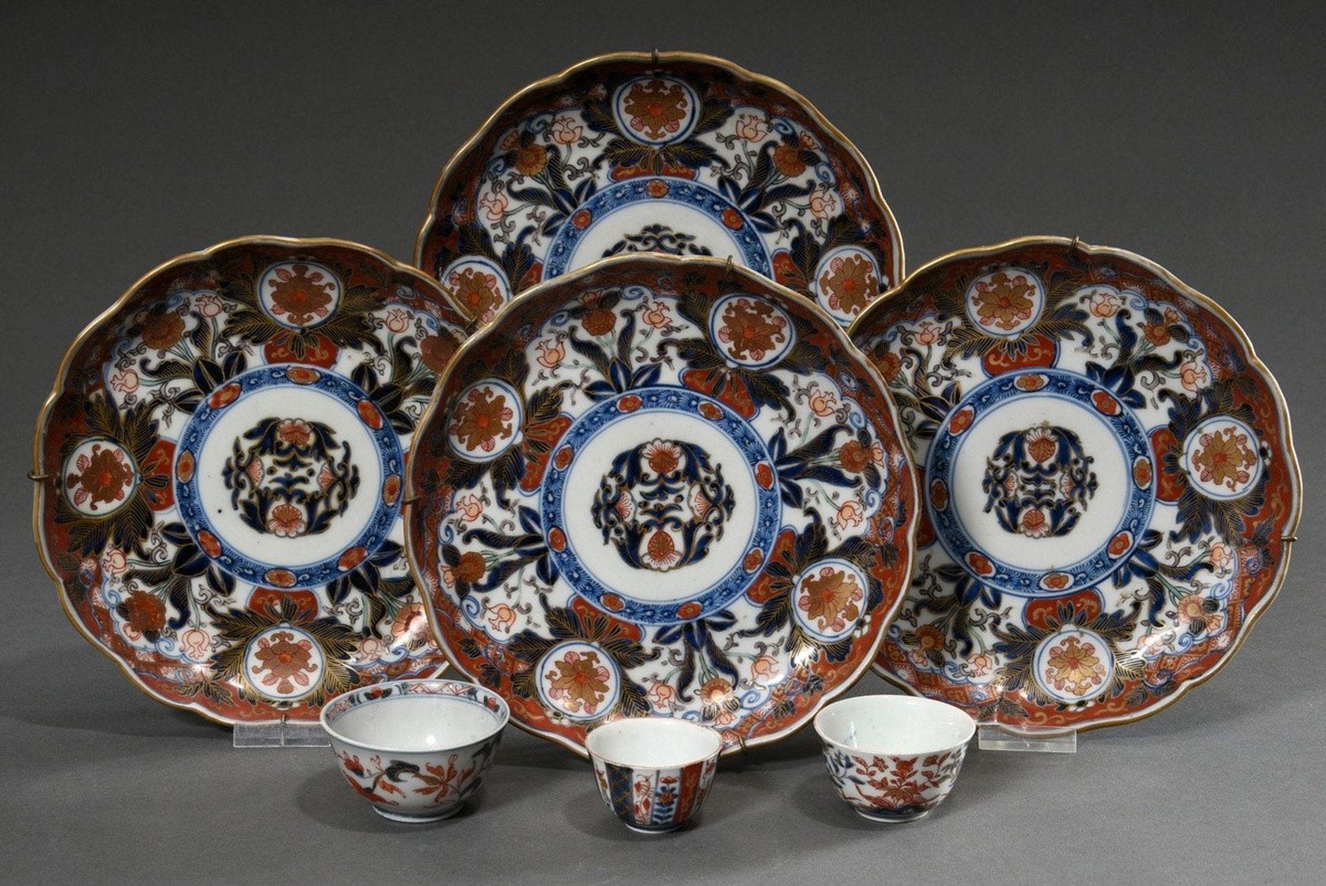 7 Various Japanese porcelains with Imari décor in underglaze blue, iron red and gold: 3 various sak