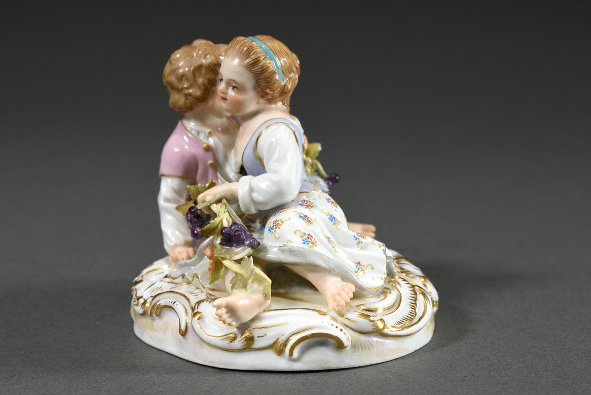 Small Meissen group "Two Children with Grapes", a boy and a girl sitting on an oval rocaille base f - Image 4 of 7