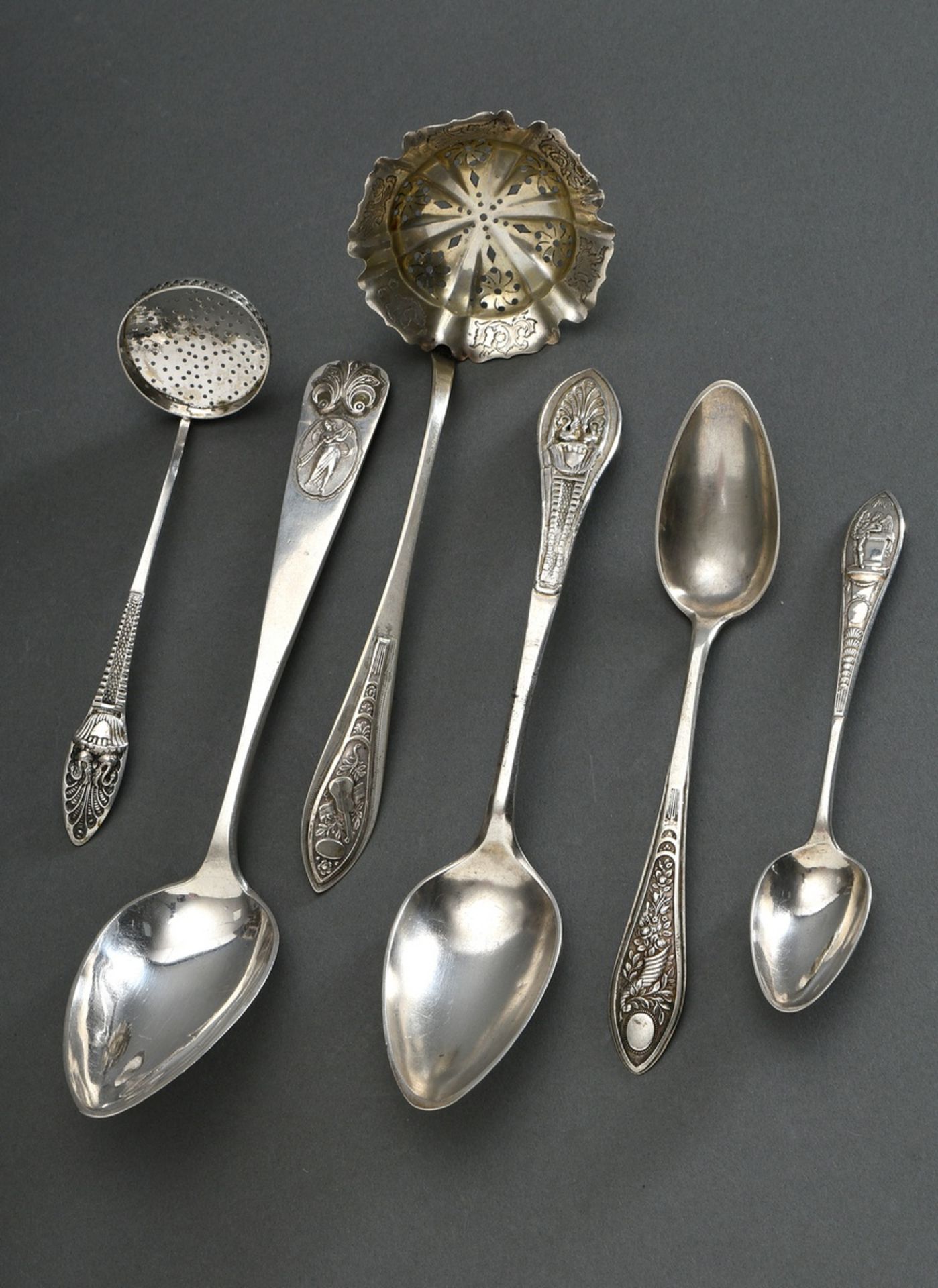 6 Various Biedermeier cutlery pieces (spoons/ sieve ladles) with richly reliefed handle ends and en