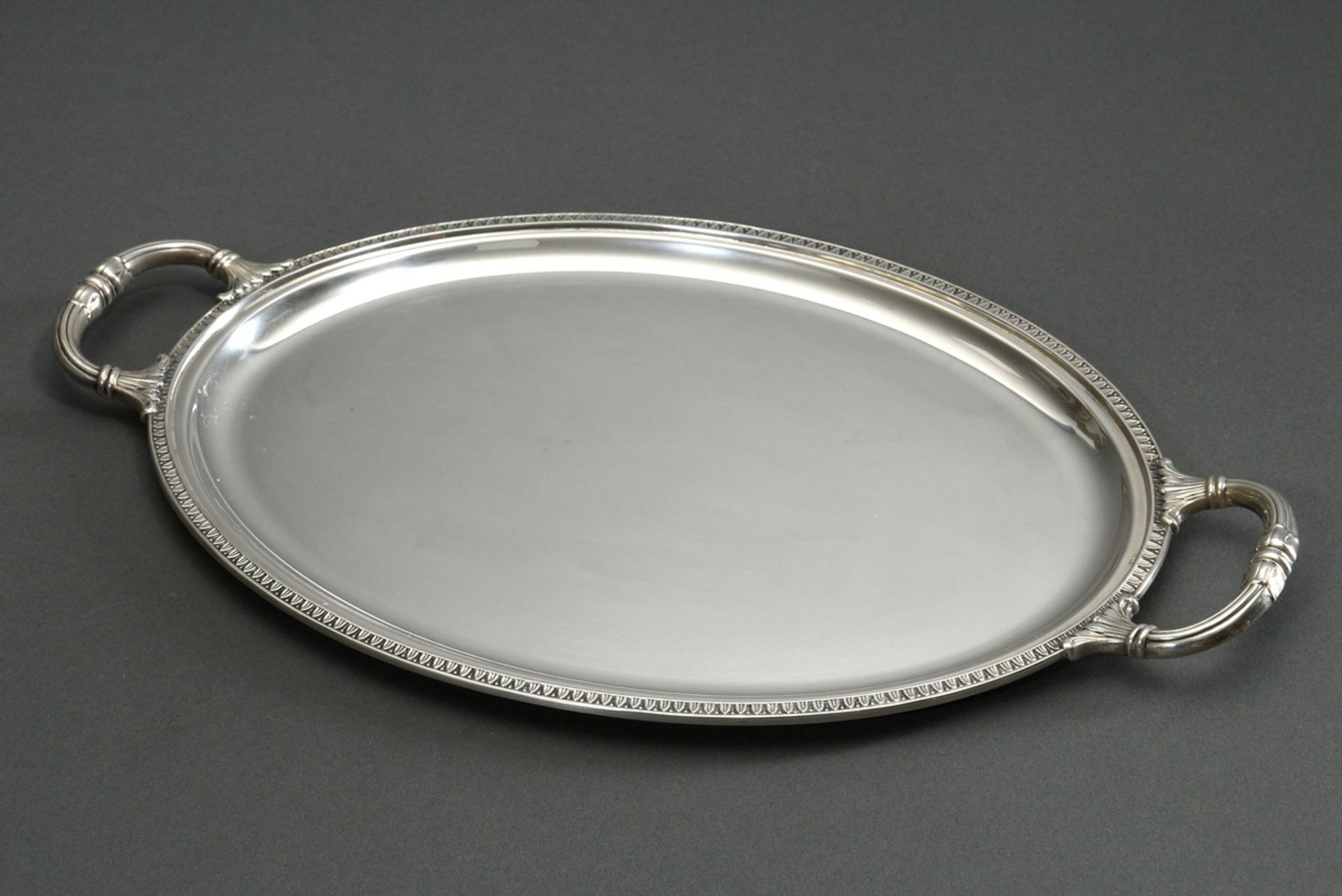Oval tray in classical shape with relief rim and handles, silver 800, 525g, 41,6x24,6cm, slight sig