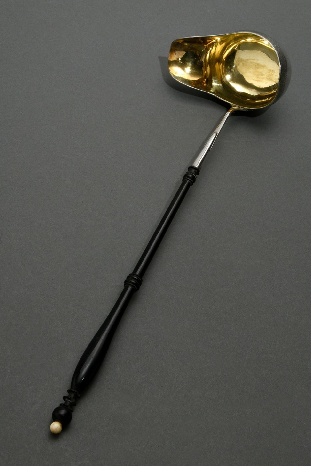 Hamburg punch ladle with engraved ornamental frieze, leaf relief and black turned wooden handle, do