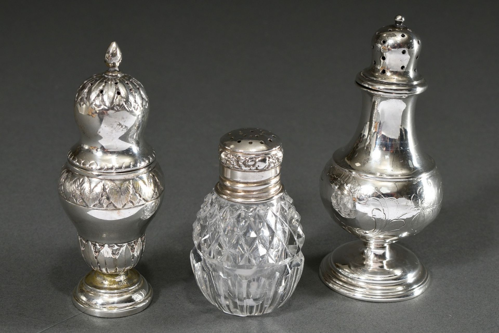 3 Various salt cellars in different shapes: 1x baluster-shaped with floral engraving, 1x vase-shape
