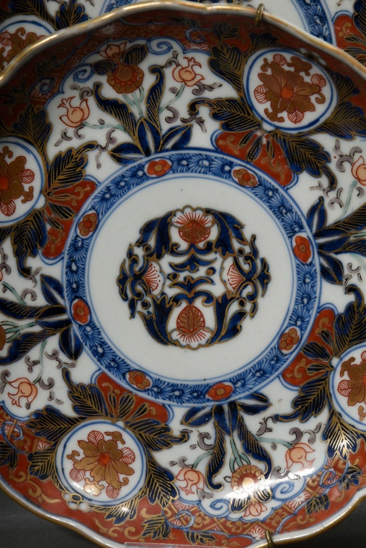 7 Various Japanese porcelains with Imari décor in underglaze blue, iron red and gold: 3 various sak - Image 3 of 8