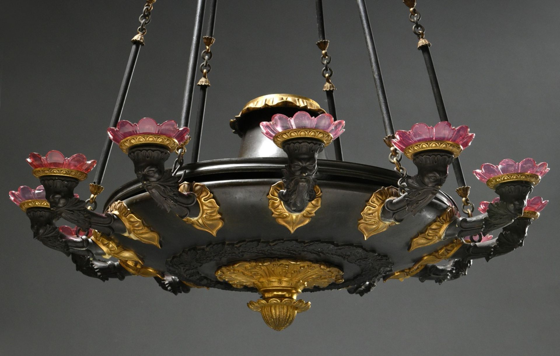 Large 12-flame Empire bronze ceiling chandelier with fire-gilded leaf friezes and bearded mascarons