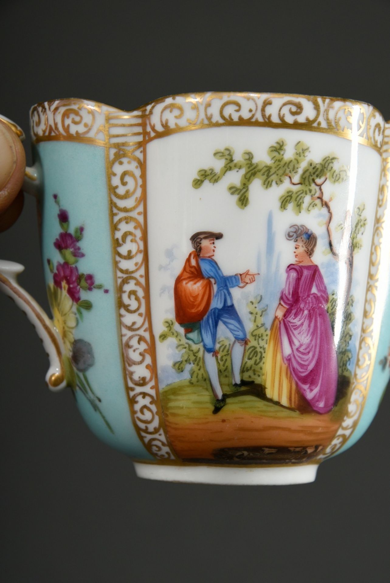 A four-piece porcelain cup/saucer with polychrome painting "Lovers" and "Blossoms" on a turquoise b - Image 5 of 8