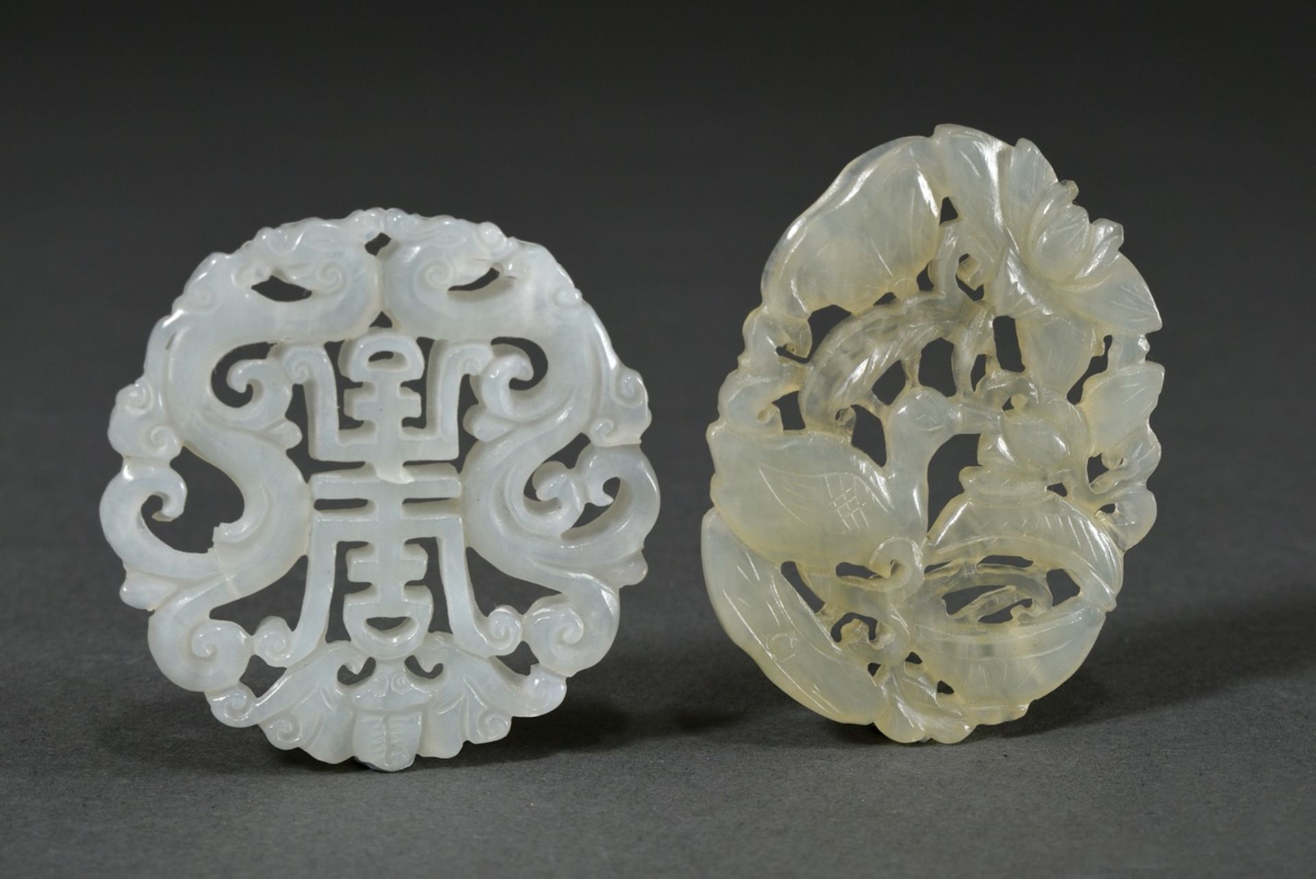 2 Various openwork light jade plaques: "Long life, dragon and bat" and "Duck with lotus blossoms", 