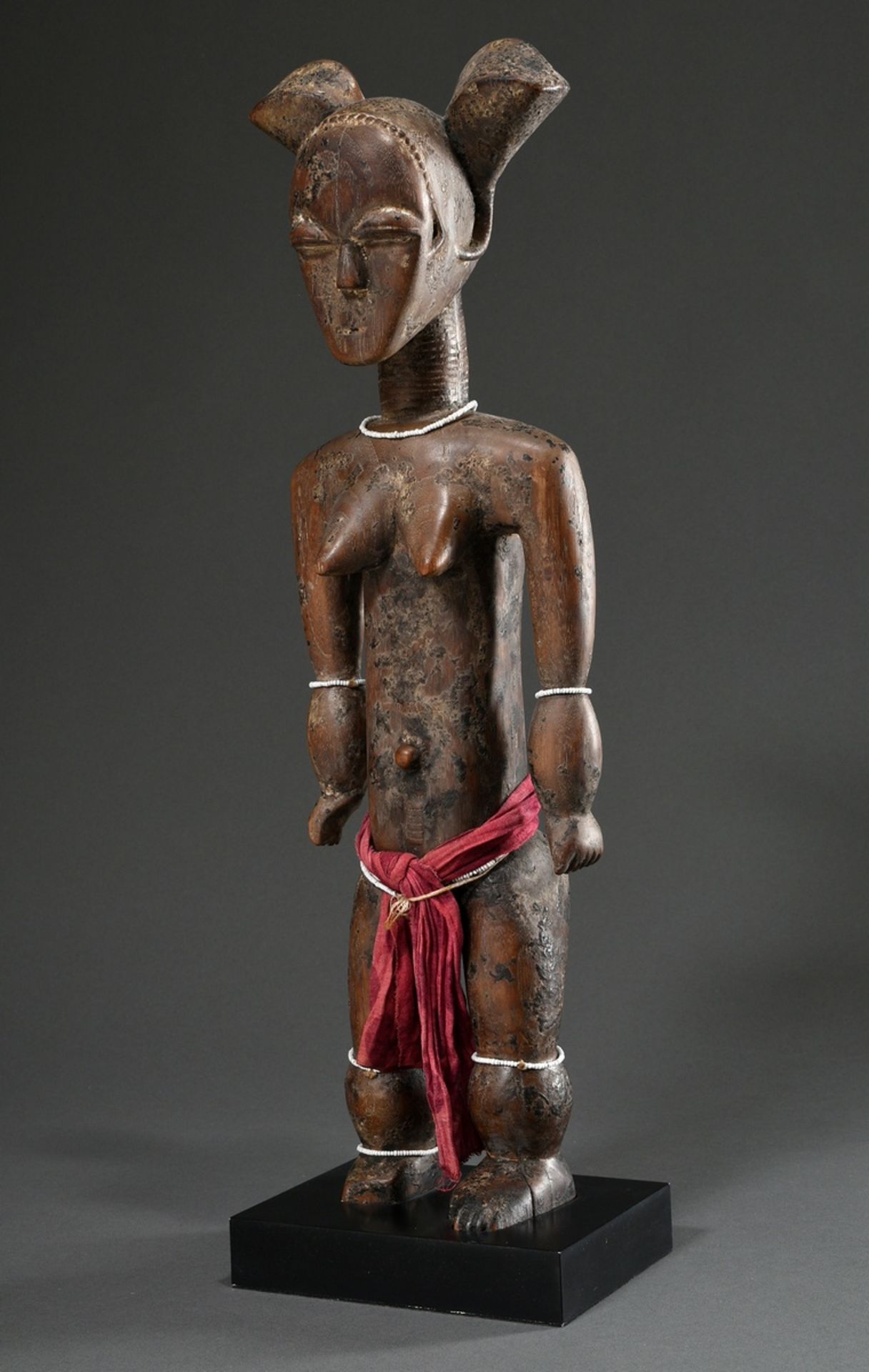 Attie female figure or fertility fetish with fanciful coiffure and scarification marks as well as p