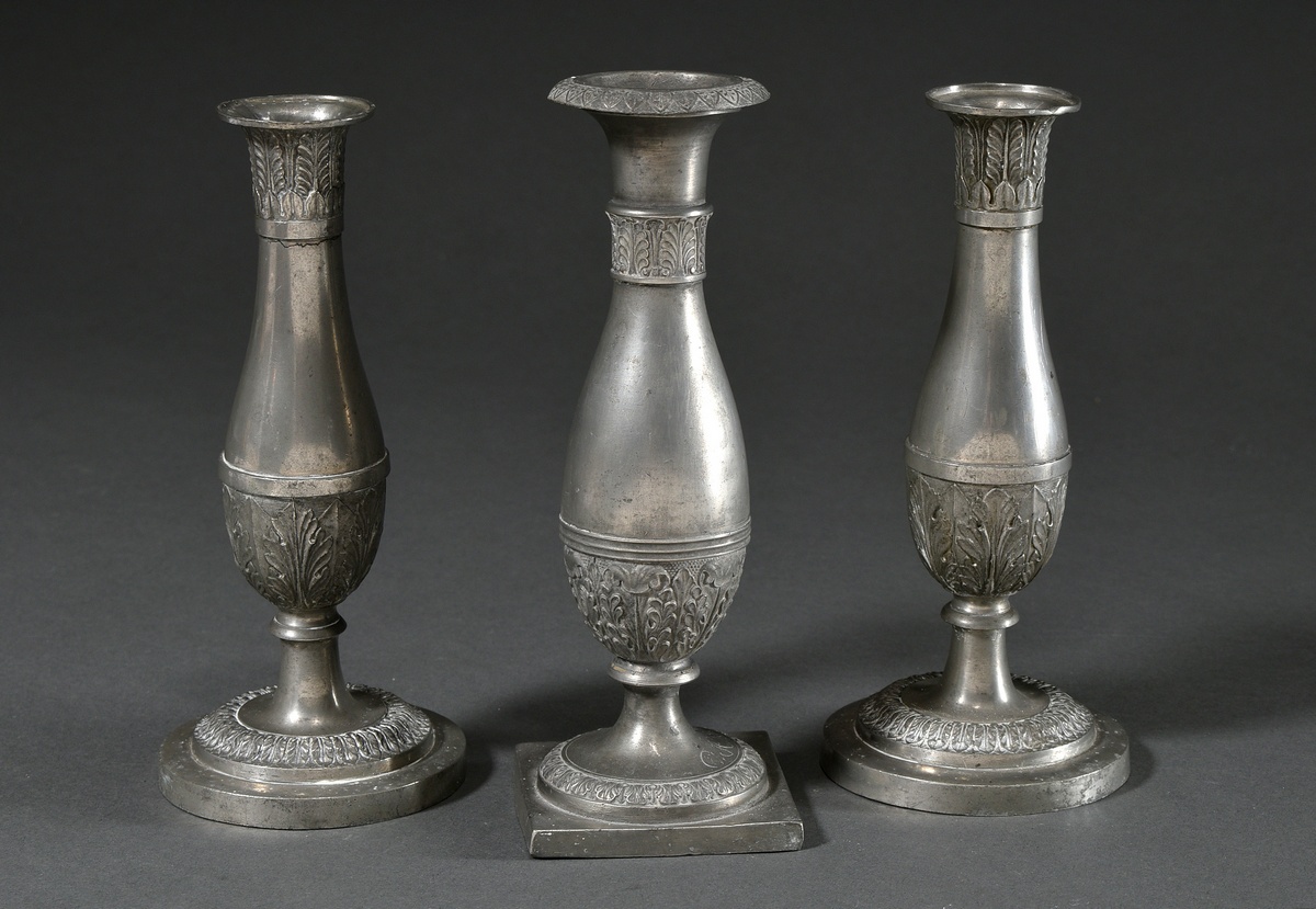 3 Various Saxon pewter candlesticks in Empire form on angular bases with baluster stems and palmett