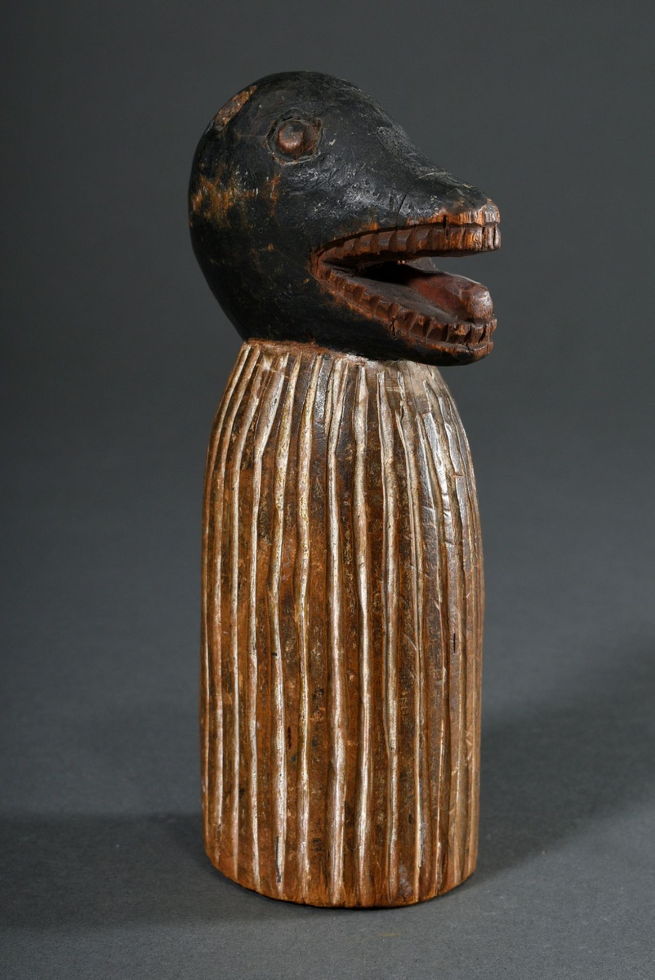 Small African carving "mask wearer with bast skirt", wood carved and coloured, h. 16,5cm, missing p