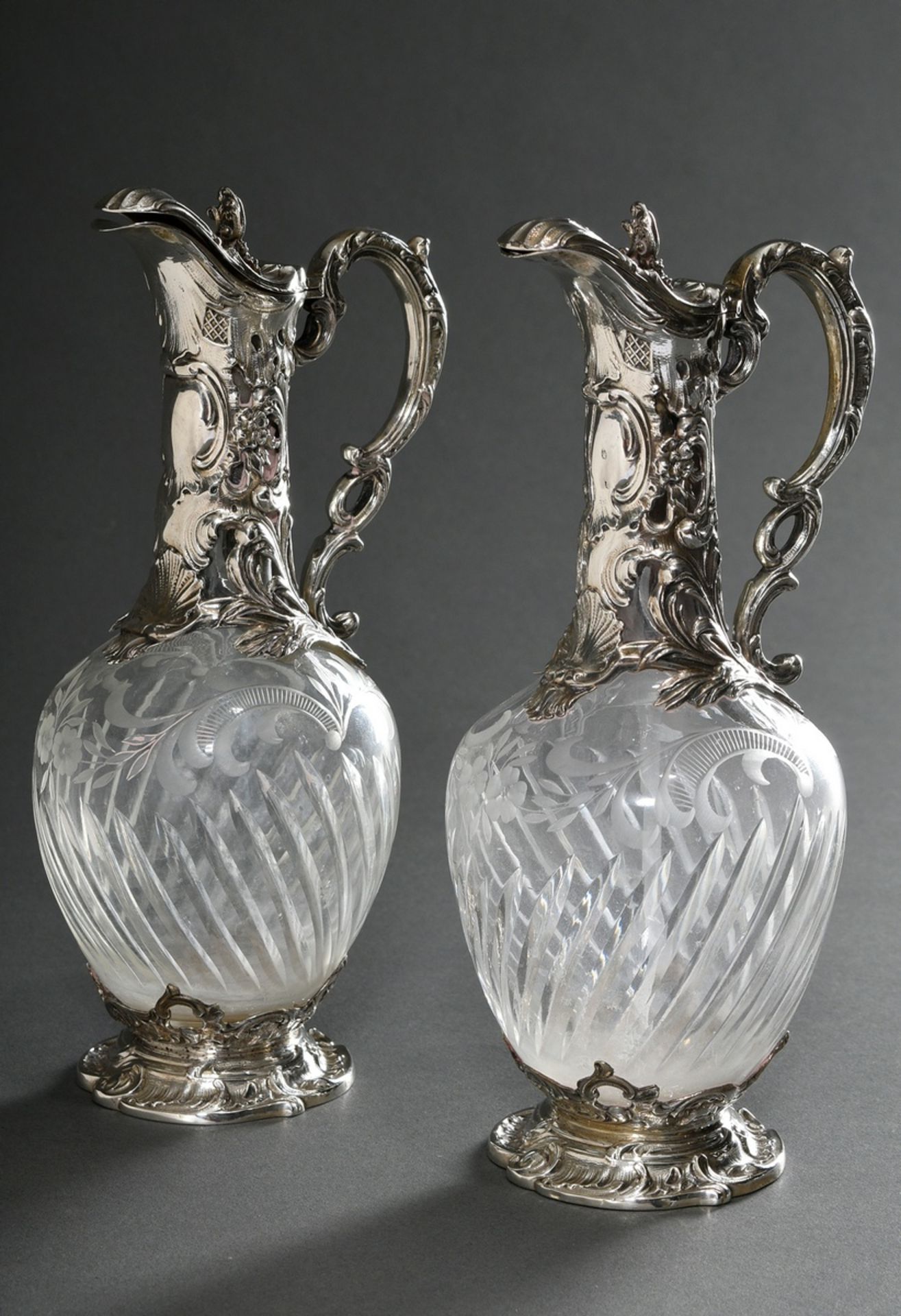 2 Small rum decanters with floral silver mounting in neo-rococo style on neck and foot as well as d